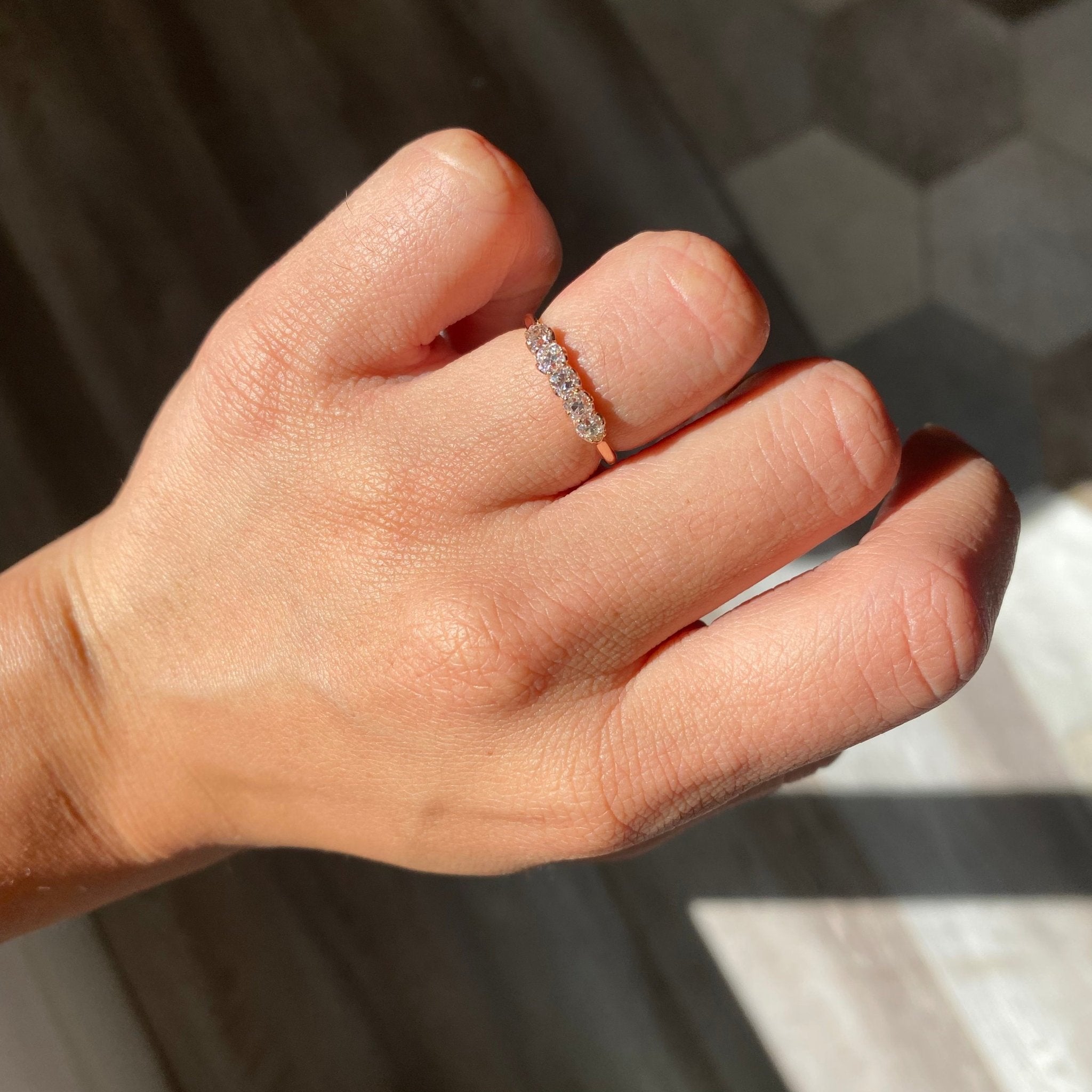 Elegant .56ctw Petite Old Mine Cut Diamond 5-Stone Band, romantic design with Old Mine Cut Diamonds, Earth-mined diamonds in rose gold shown on ring finger.