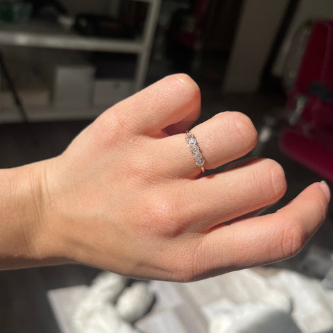 Elegant .56ctw Petite Old Mine Cut Diamond 5-Stone Band, romantic design with Old Mine Cut Diamonds, Earth-mined diamonds in rose gold shown on ring finger.