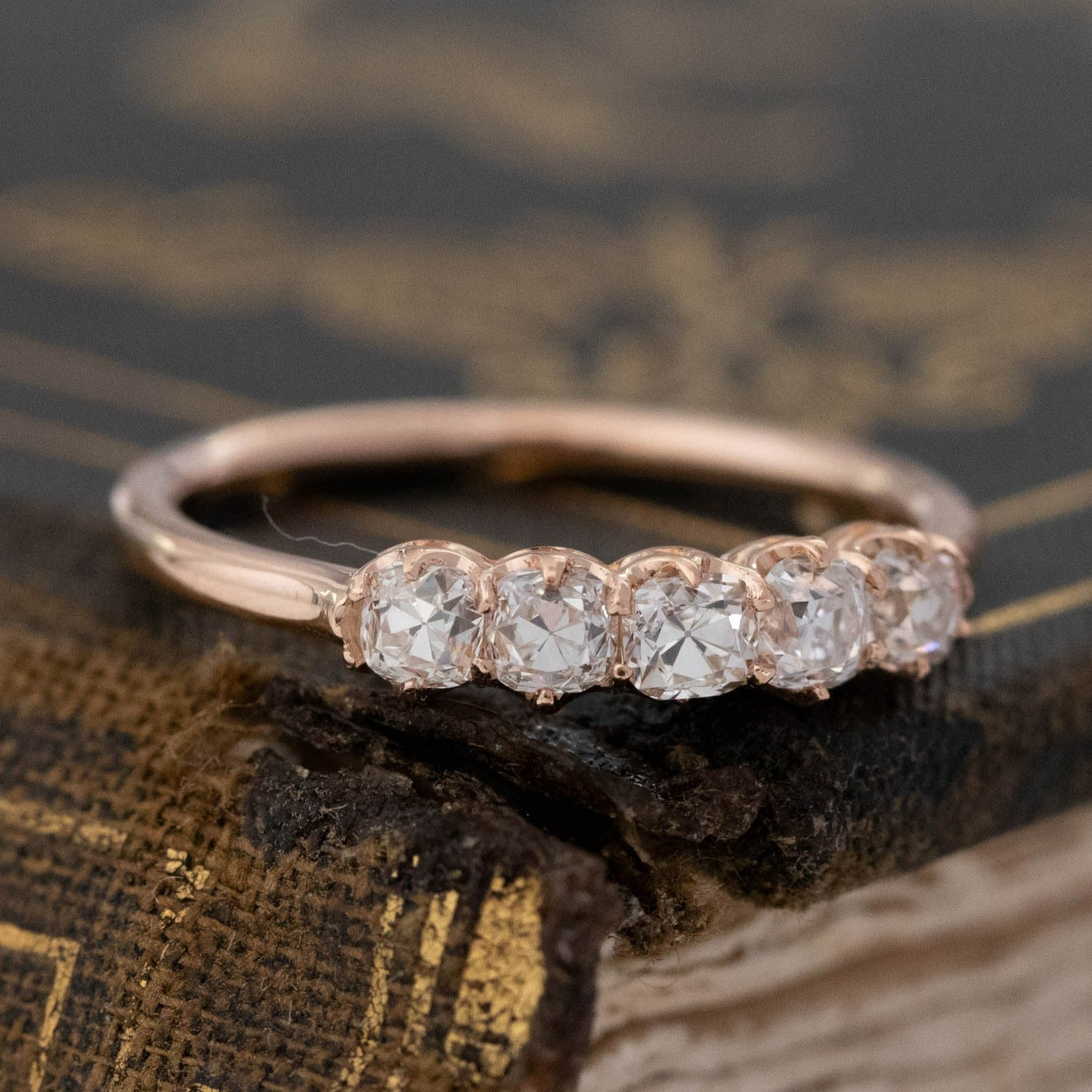 Close-up of .56ctw Petite Old Mine Cut Diamond 5-Stone Band, vintage-inspired band with Old Mine Cut Diamonds, crafted in rose gold.