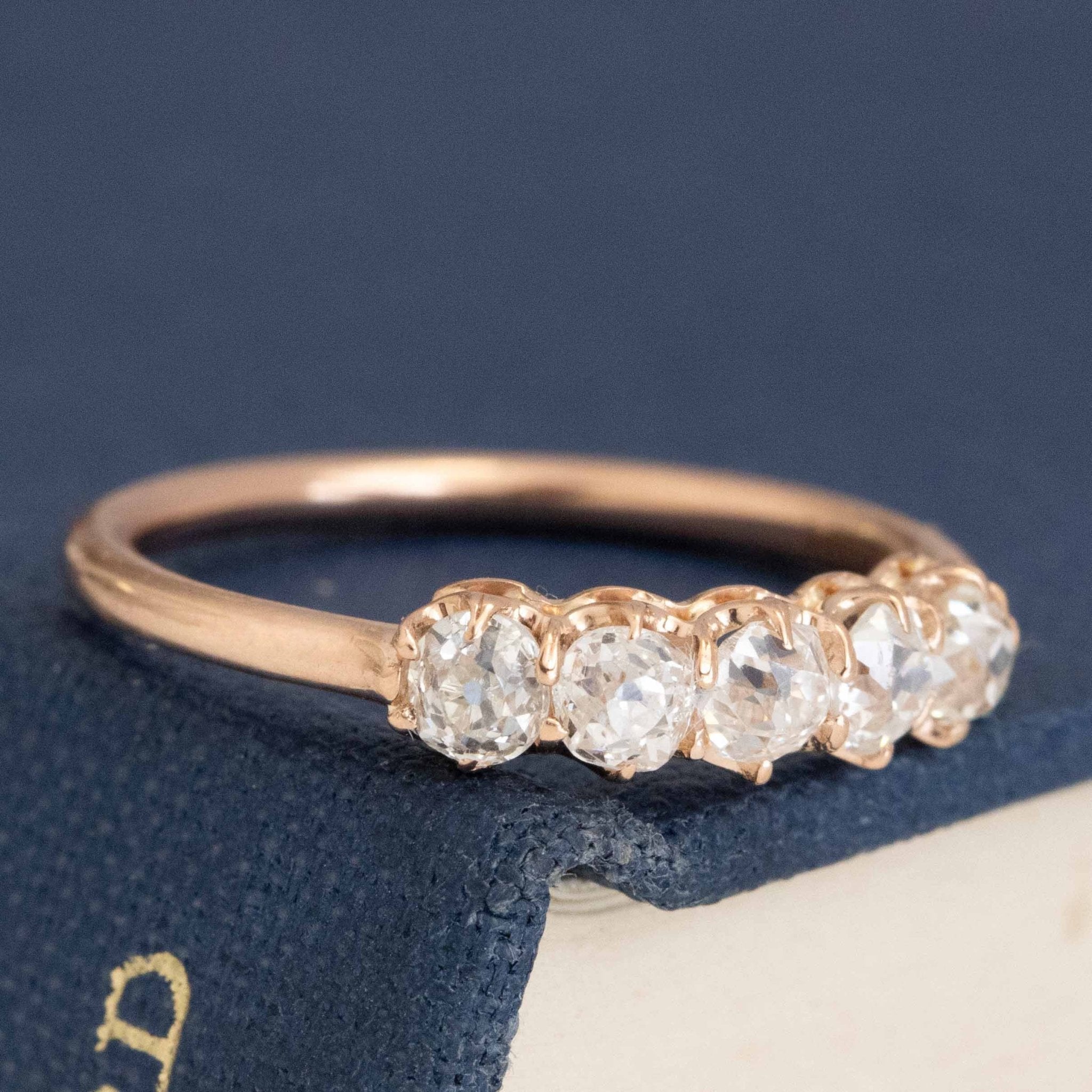 Close-up of .56ctw Petite Old Mine Cut Diamond 5-Stone Band, vintage-inspired band with Old Mine Cut Diamonds, crafted in rose gold.