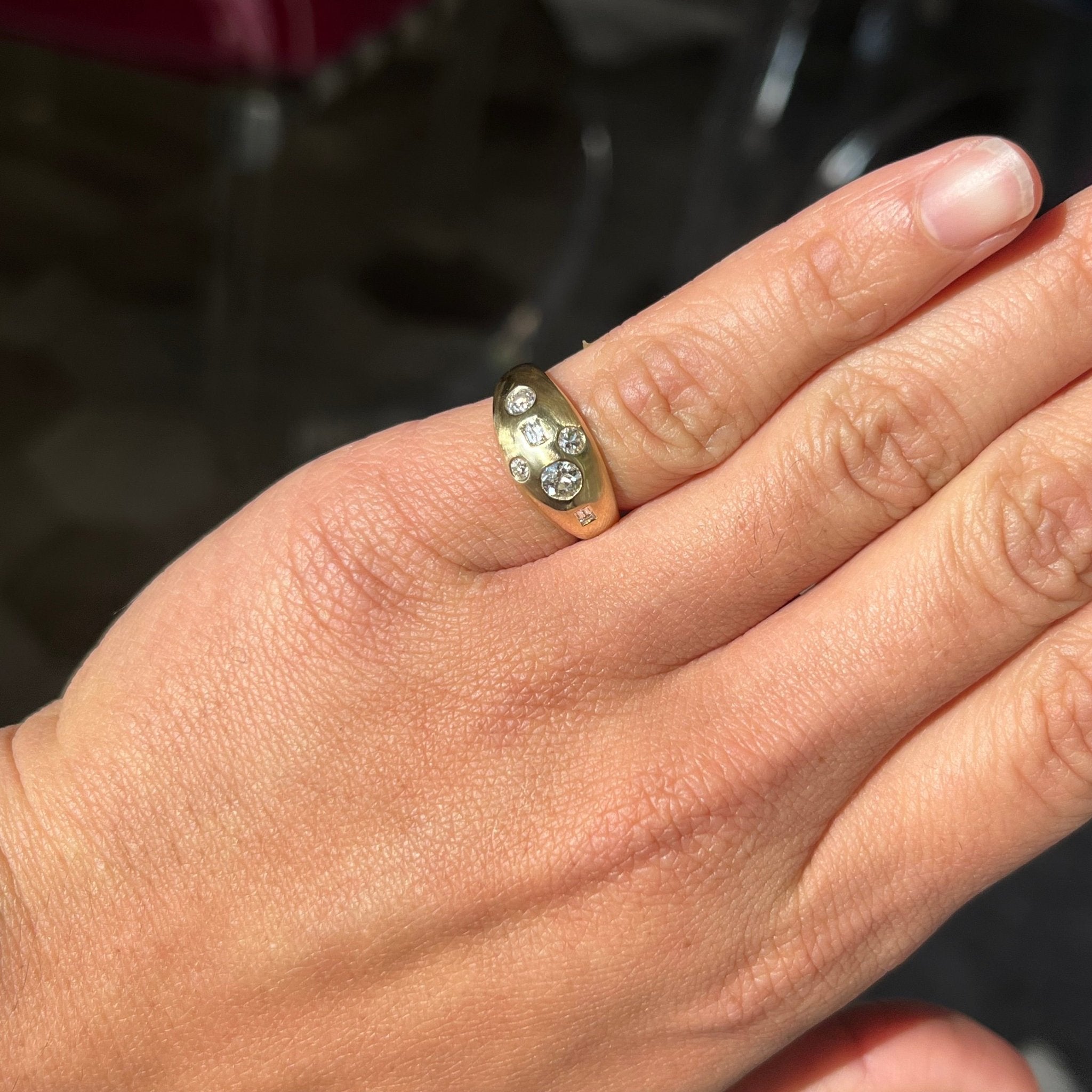 Elegant .57ctw Mixed Cut Diamond Bombe Ring, romantic design with Antique Diamonds, Earth-mined diamonds in yellow gold shown on ring finger.