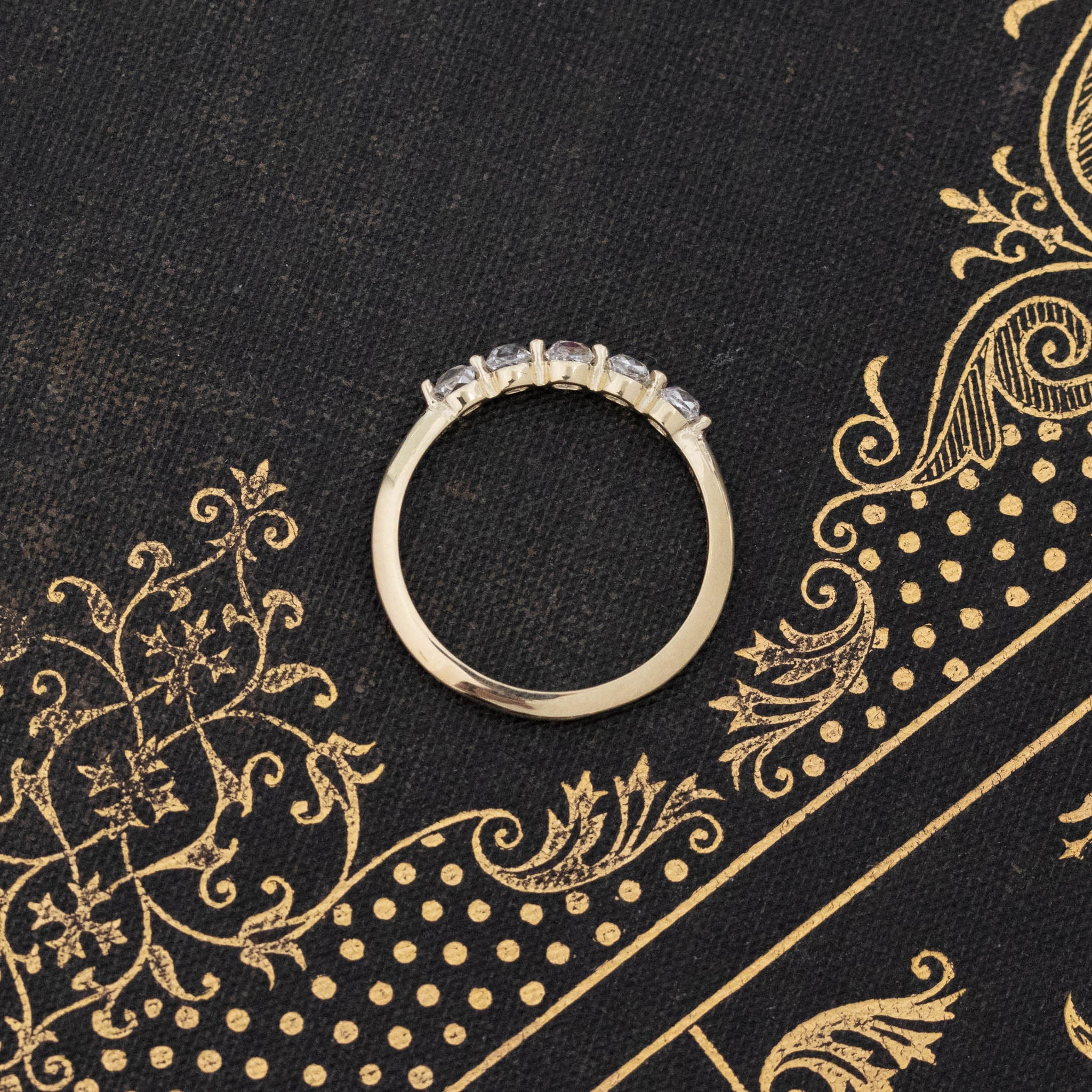 Side view of .58ctw Petite Old Mine Cut Diamond Shared Prong Band, natural Earth-mined Old Mine Cut Diamonds in yellow gold.