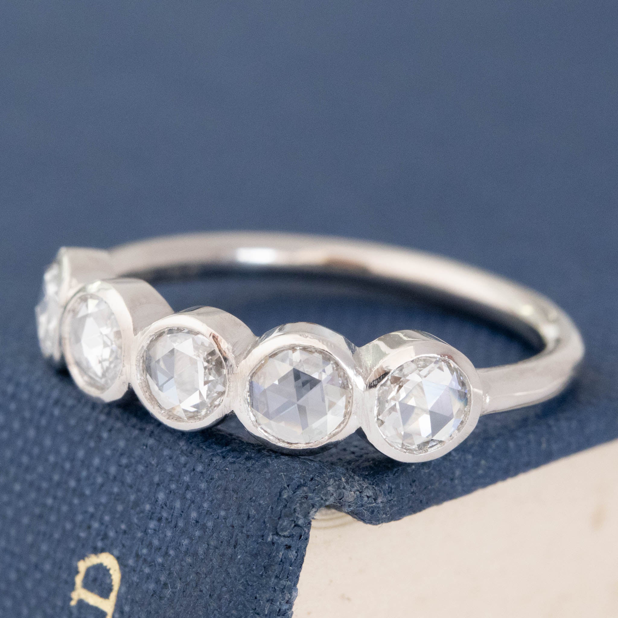 Antique lovers’ .59ctw Round Rose Cut Diamond 5-Stone Bezel Band in platinum, featuring rare Earth-mined Antique Diamonds.
