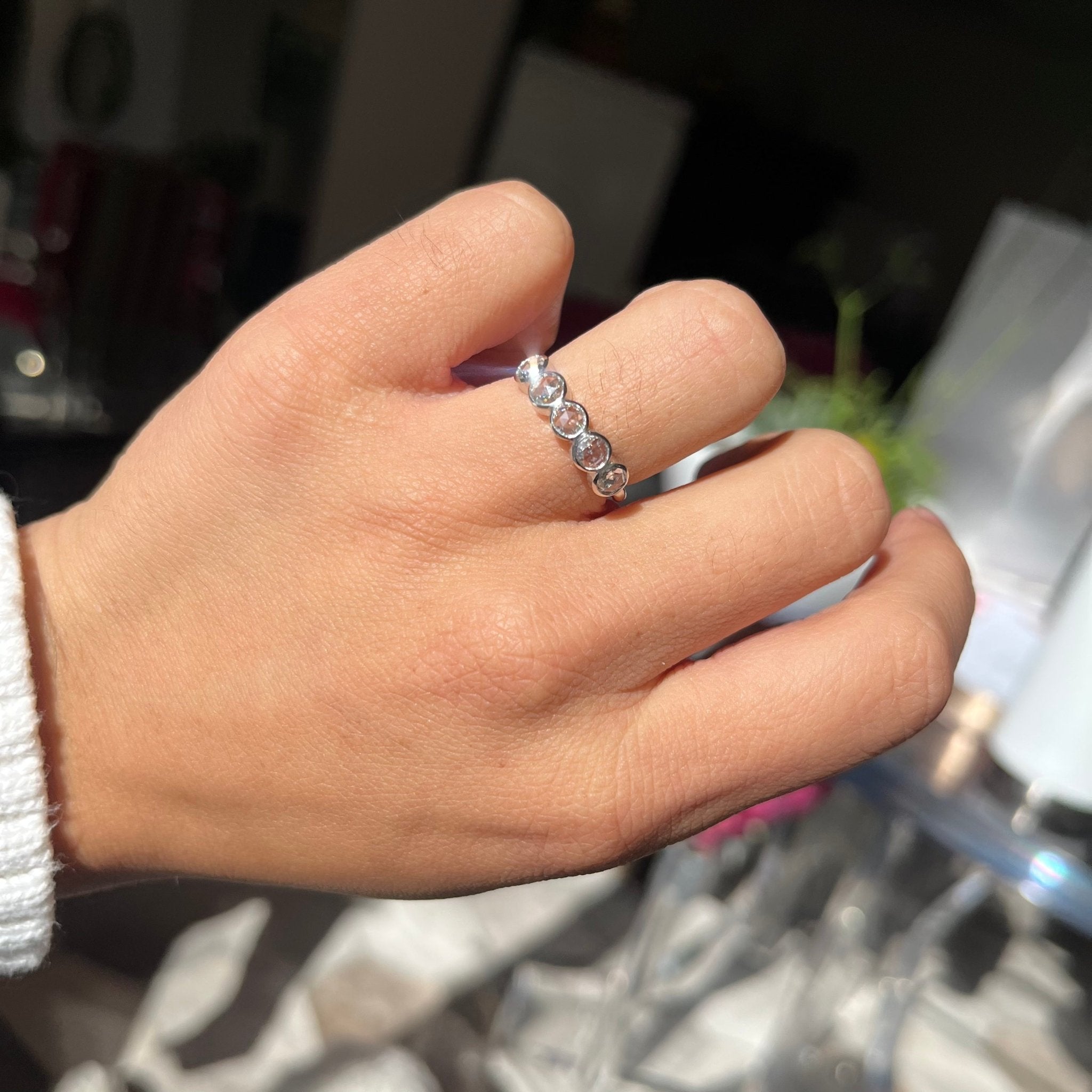 Elegant .59ctw Round Rose Cut Diamond 5-Stone Bezel Band, romantic design with Antique Diamonds, Earth-mined diamonds in platinum shown on ring finger.