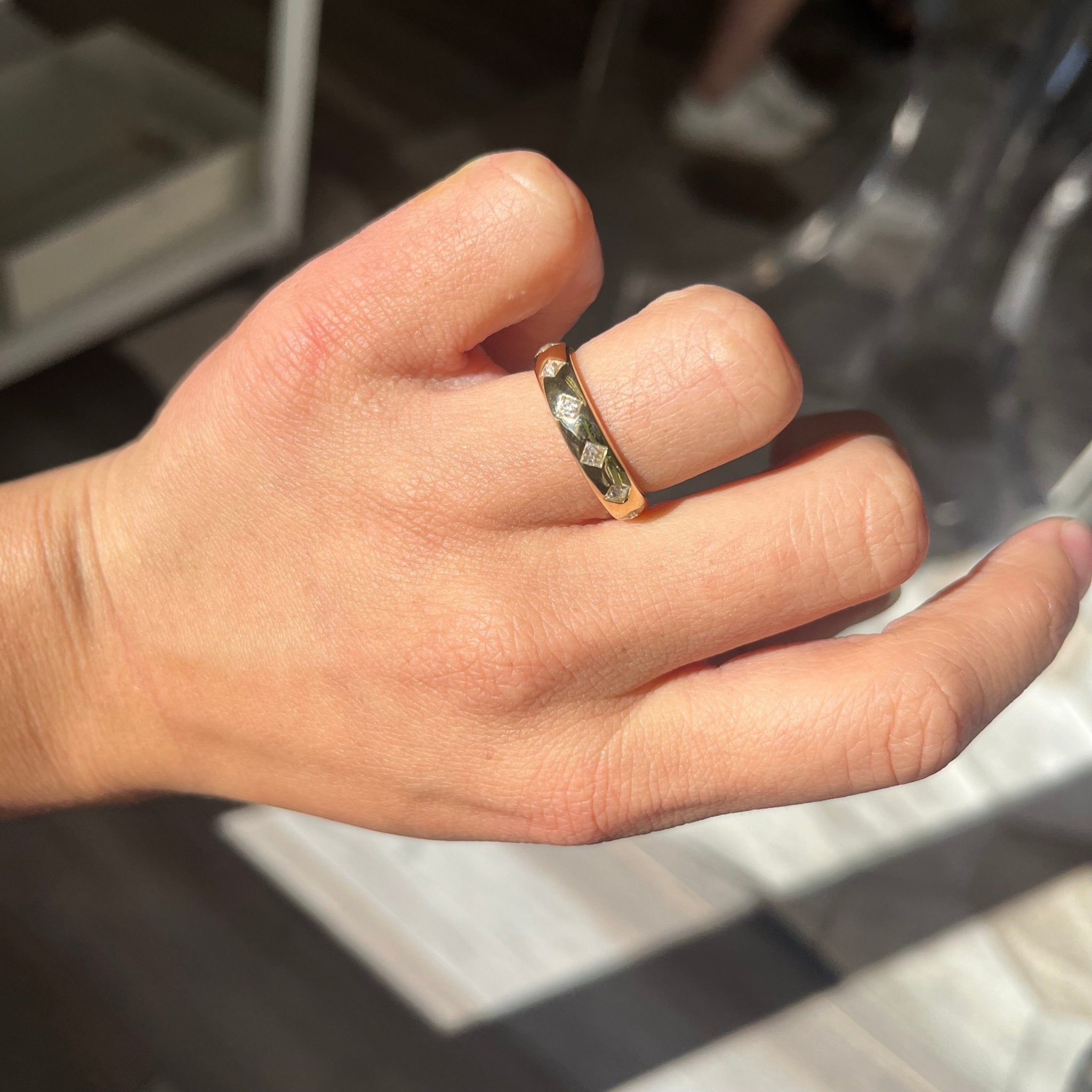 Elegant .60ctw French Cut Diamond Scatter Band, romantic design with French Cut Diamonds, Earth-mined diamonds in yellow gold shown on ring finger.