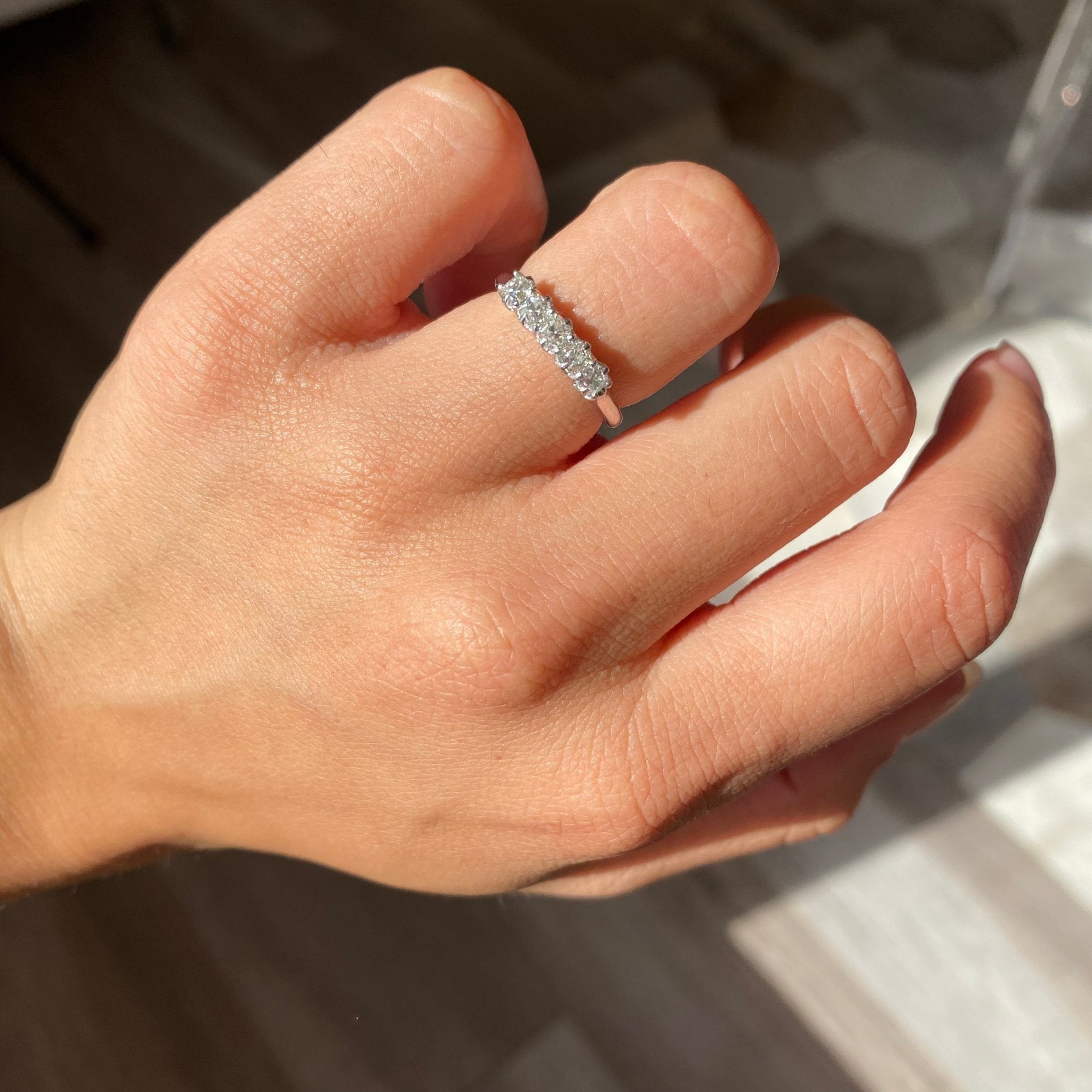 Elegant .60ctw Petite Old Mine Cut Diamond 5-Stone Band, romantic design with Old Mine Cut Diamonds, Earth-mined diamonds in platinum shown on ring finger