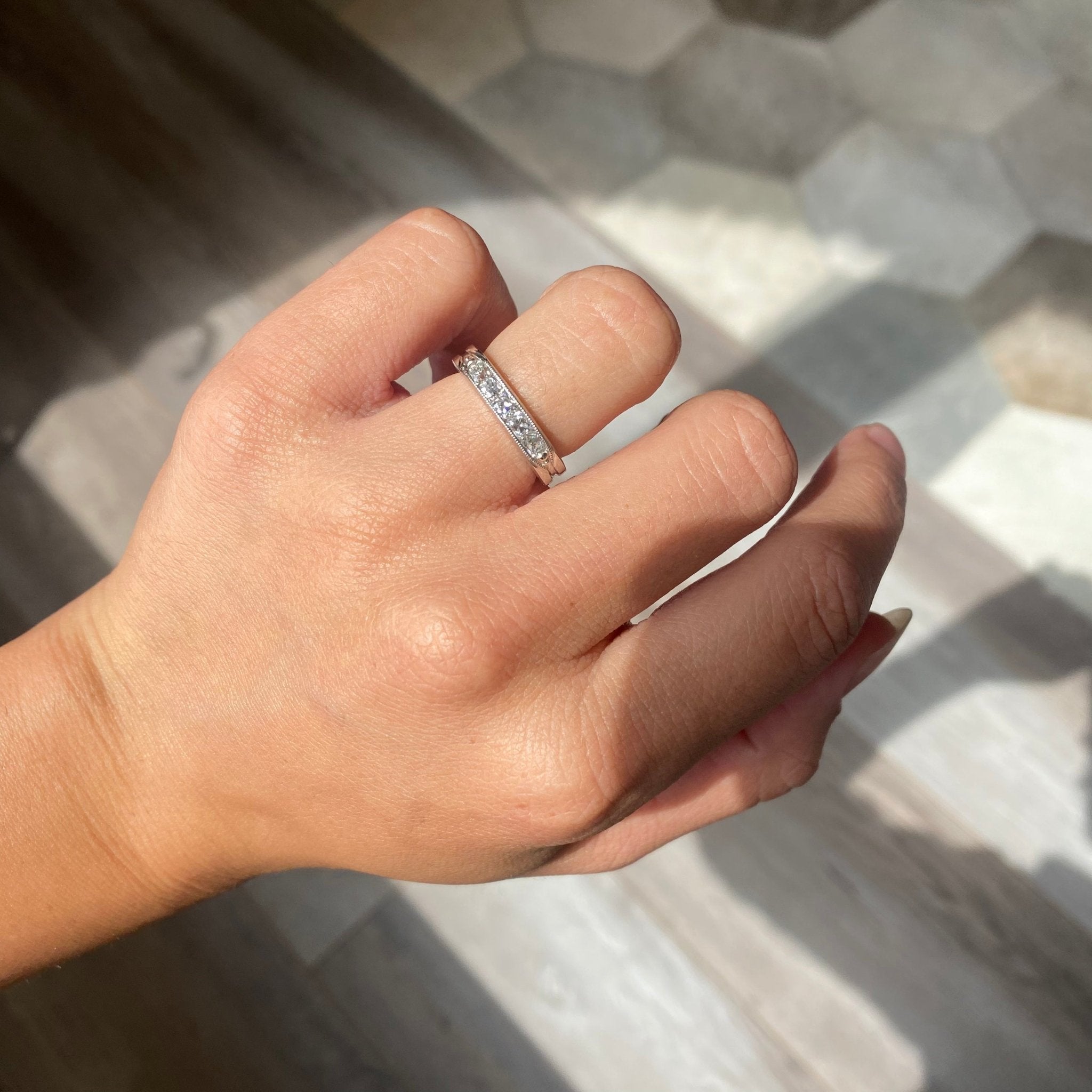 Elegant .61ctw Channel Set Old Mine Cut Diamond Band, romantic design with Old Mine Cut Diamonds, Earth-mined diamonds in platinum shown on ring finger