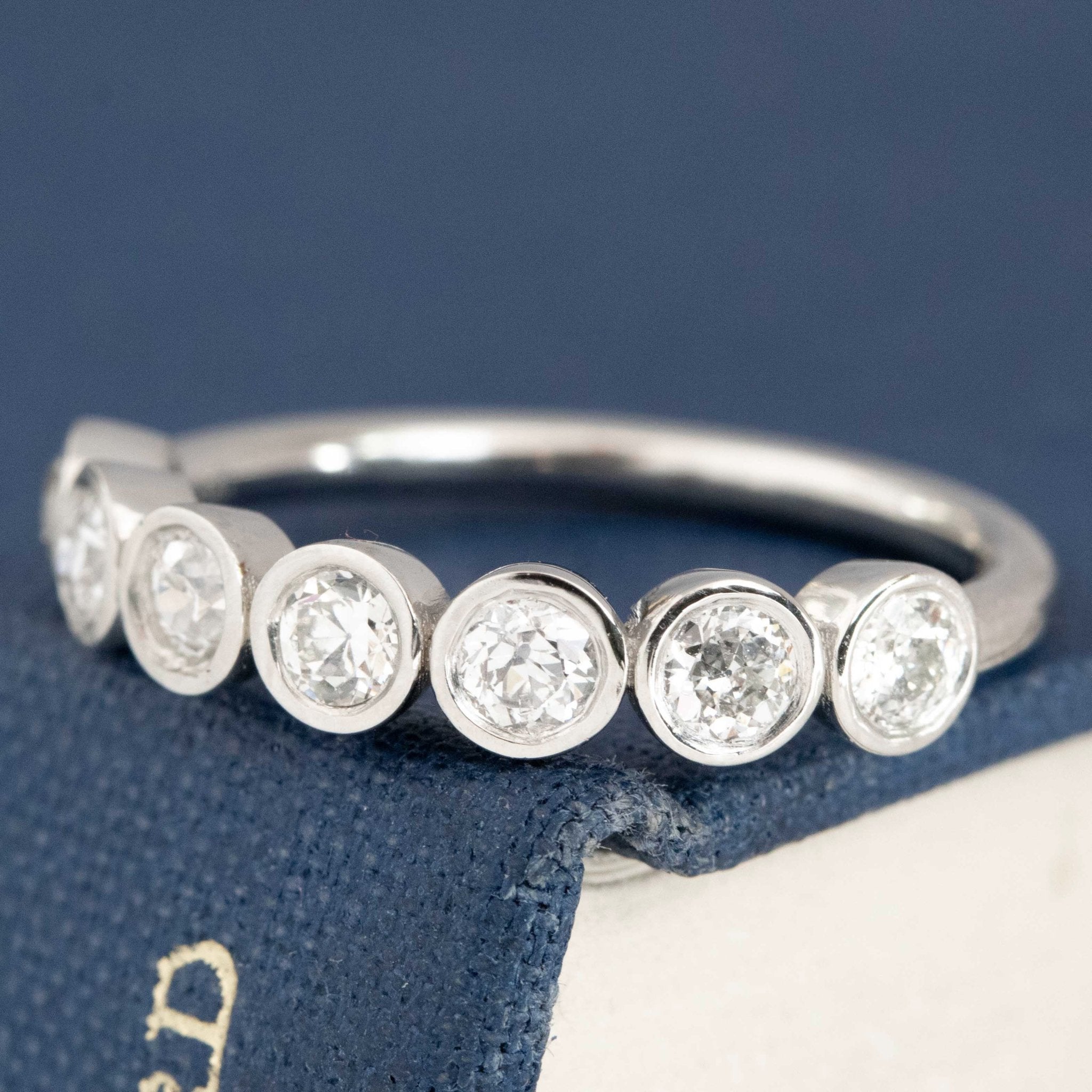 Antique lovers’ .62ctw Old European Cut Diamond 7-Stone Bezel Band in platinum, featuring rare Earth-mined Old European Cut Diamonds