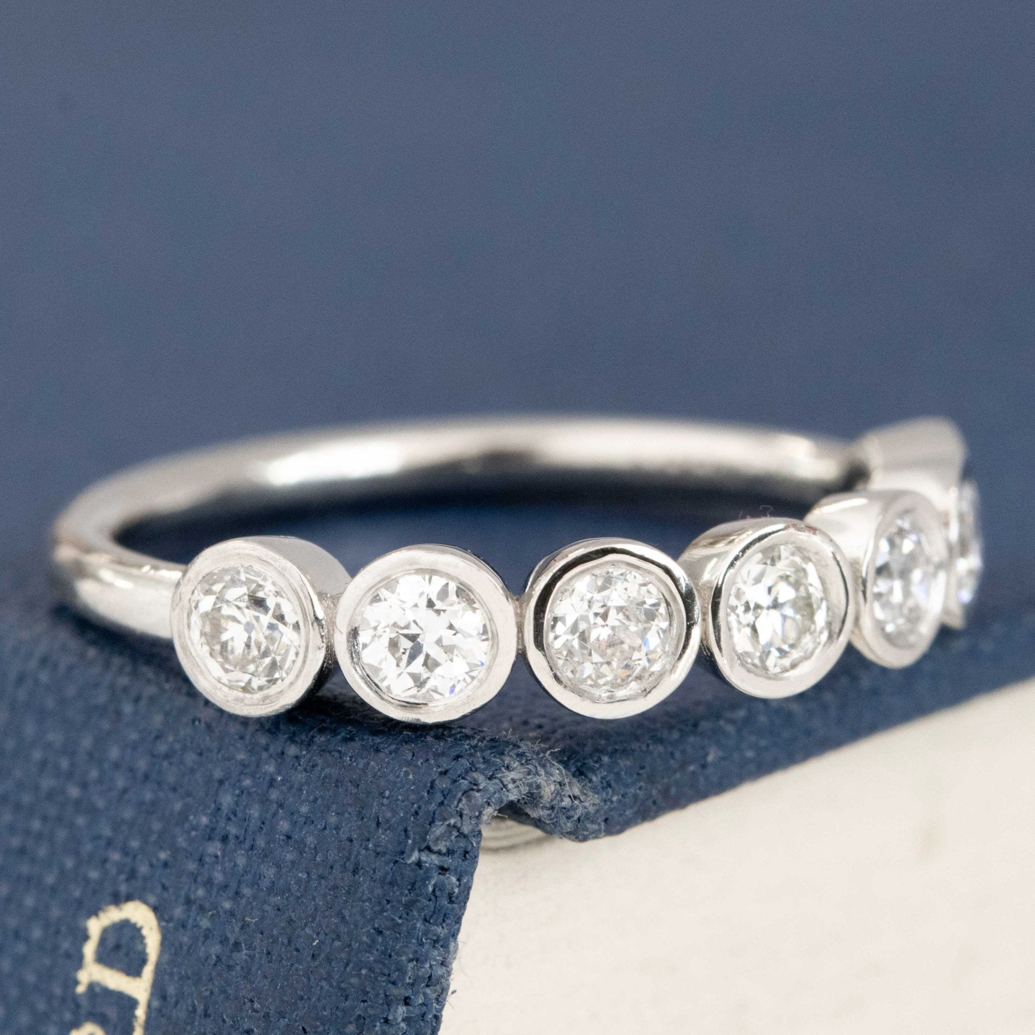 Close-up of .62ctw Old European Cut Diamond 7-Stone Bezel Band, vintage-inspired band with Old European Cut Diamonds, crafted in platinum
