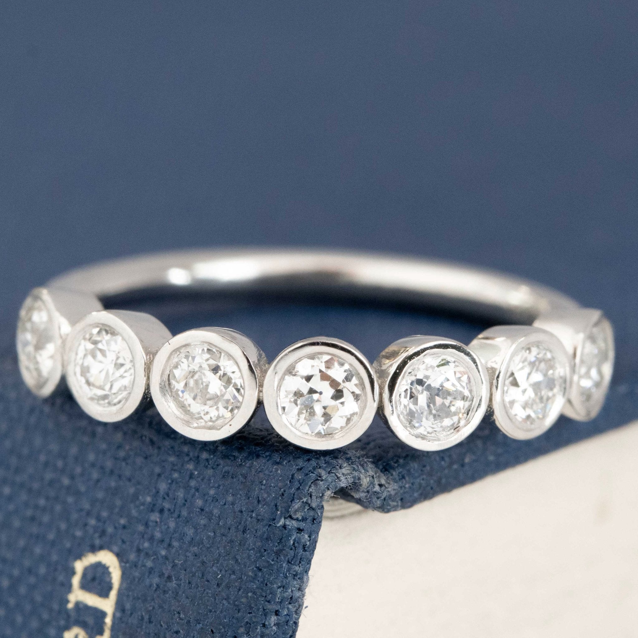 .62ctw Old European Cut Diamond 7-Stone Bezel Band with Old European Cut Diamonds in platinum, antique-inspired one-of-a-kind wedding band