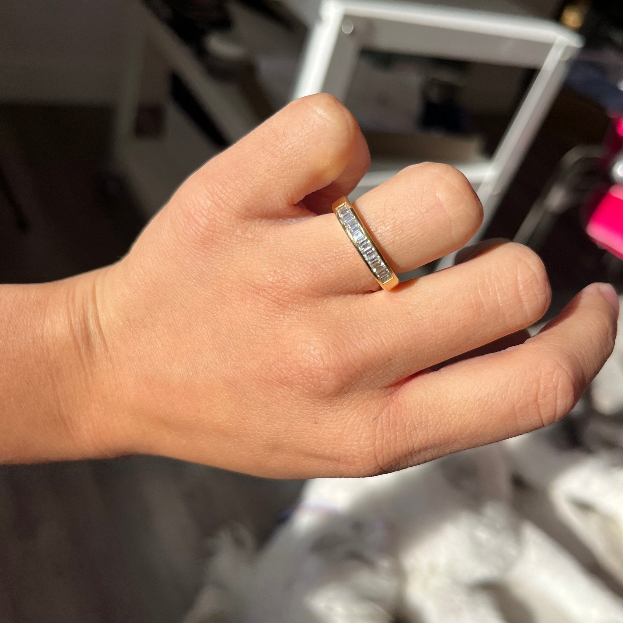 Elegant .63ctw Baguette Cut Diamond Channel Set Band, romantic design with Baguette Cut Diamonds, Earth-mined diamonds in yellow gold shown on ring finger