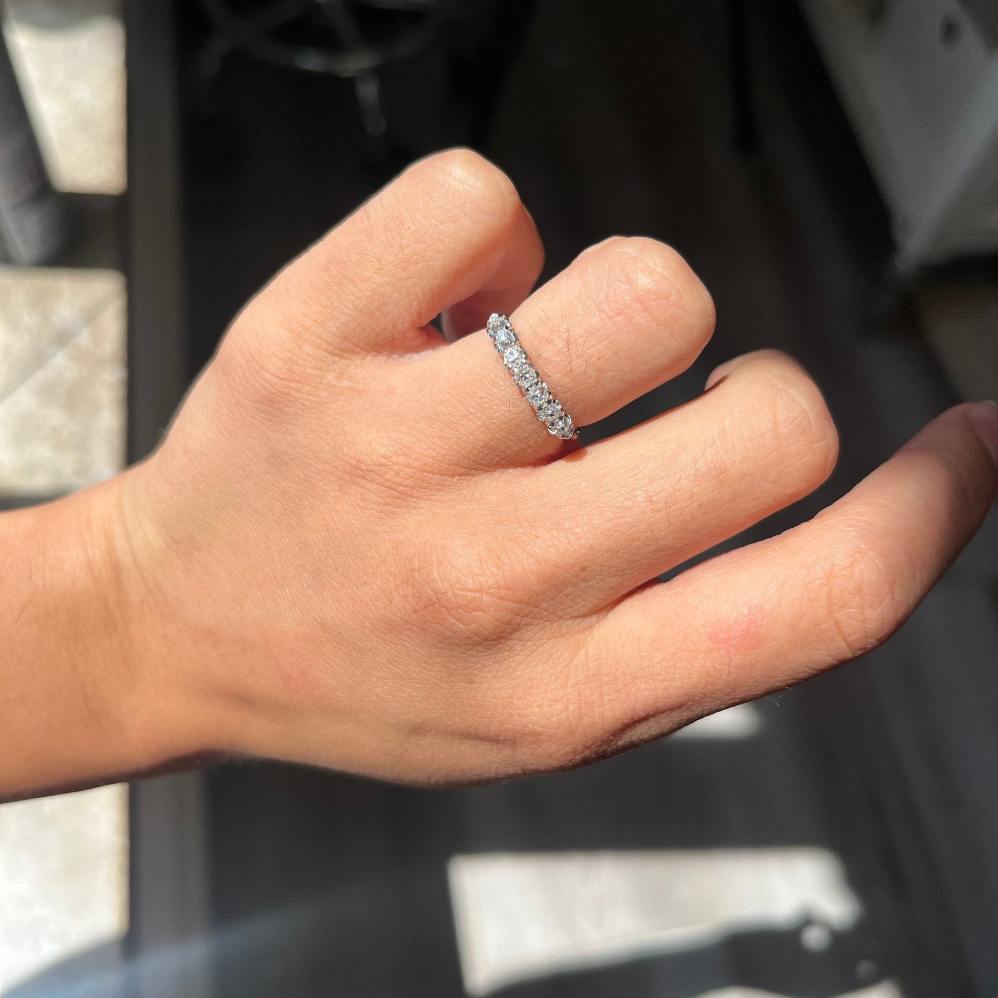 Elegant .63ctw Petite Old Mine Cut Diamond Half-Hoop Band, romantic design with Old Mine Cut Diamonds, Earth-mined diamonds in platinum shown on ring finger