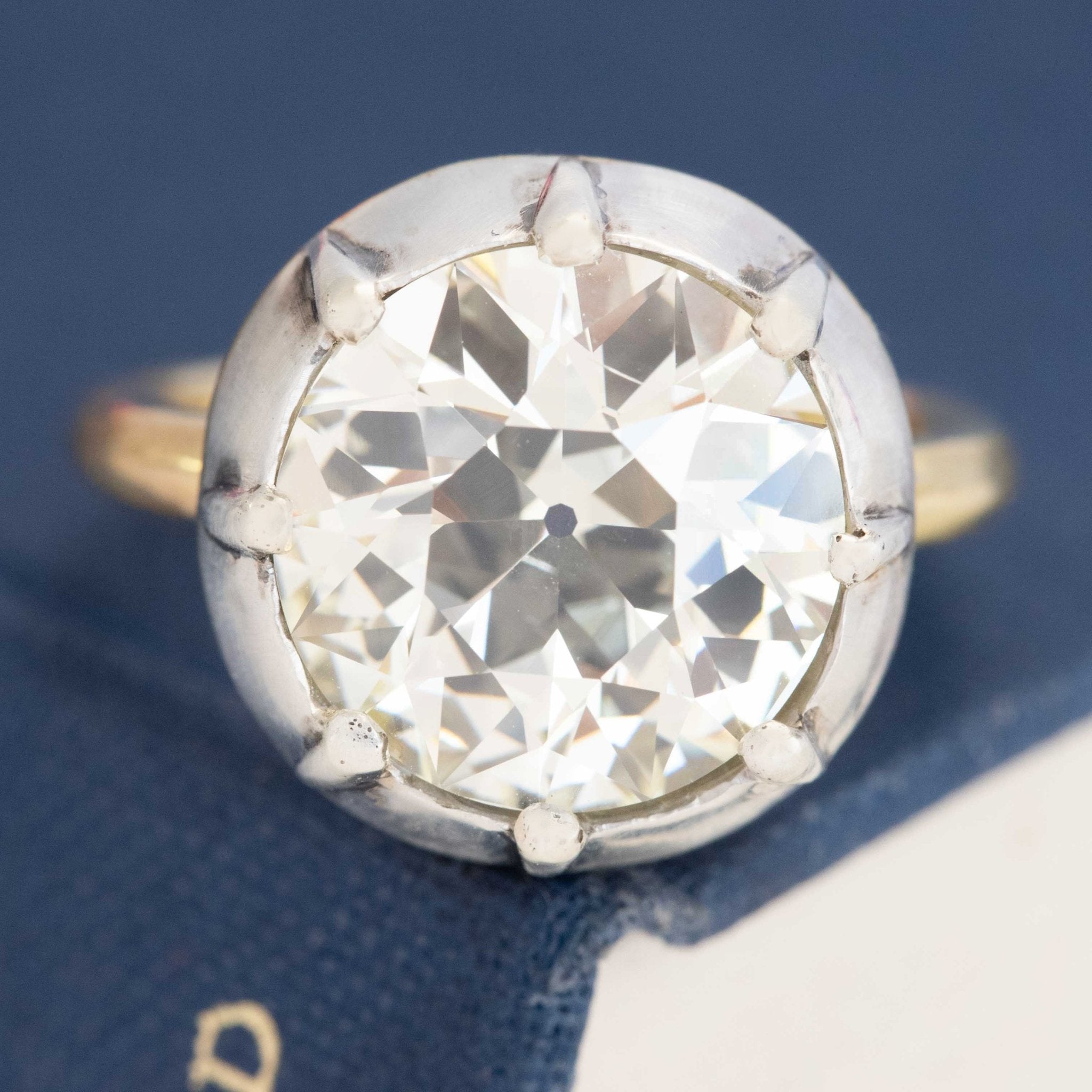 A 6.42ct old European cut diamond in a vintage inspired collet setting in silver and 18kt yellow gold. A beautiful vintage diamond and/or vintage engagement ring choice!