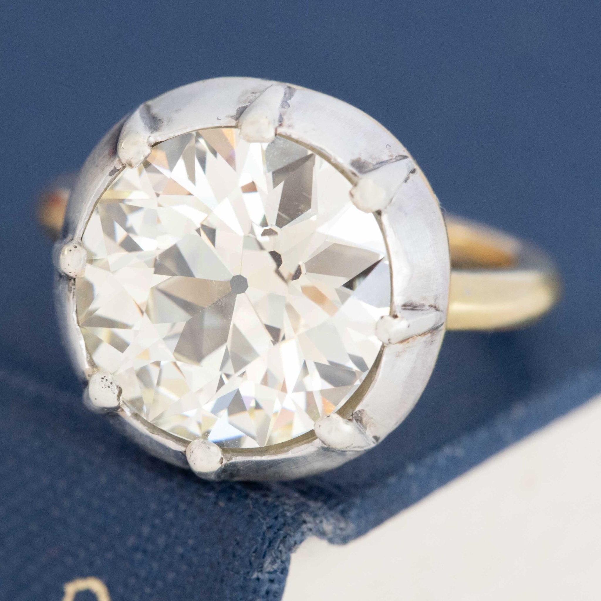 A 6.42ct old European cut diamond in a vintage inspired collet setting in silver and 18kt yellow gold. A beautiful vintage diamond and/or vintage engagement ring choice!