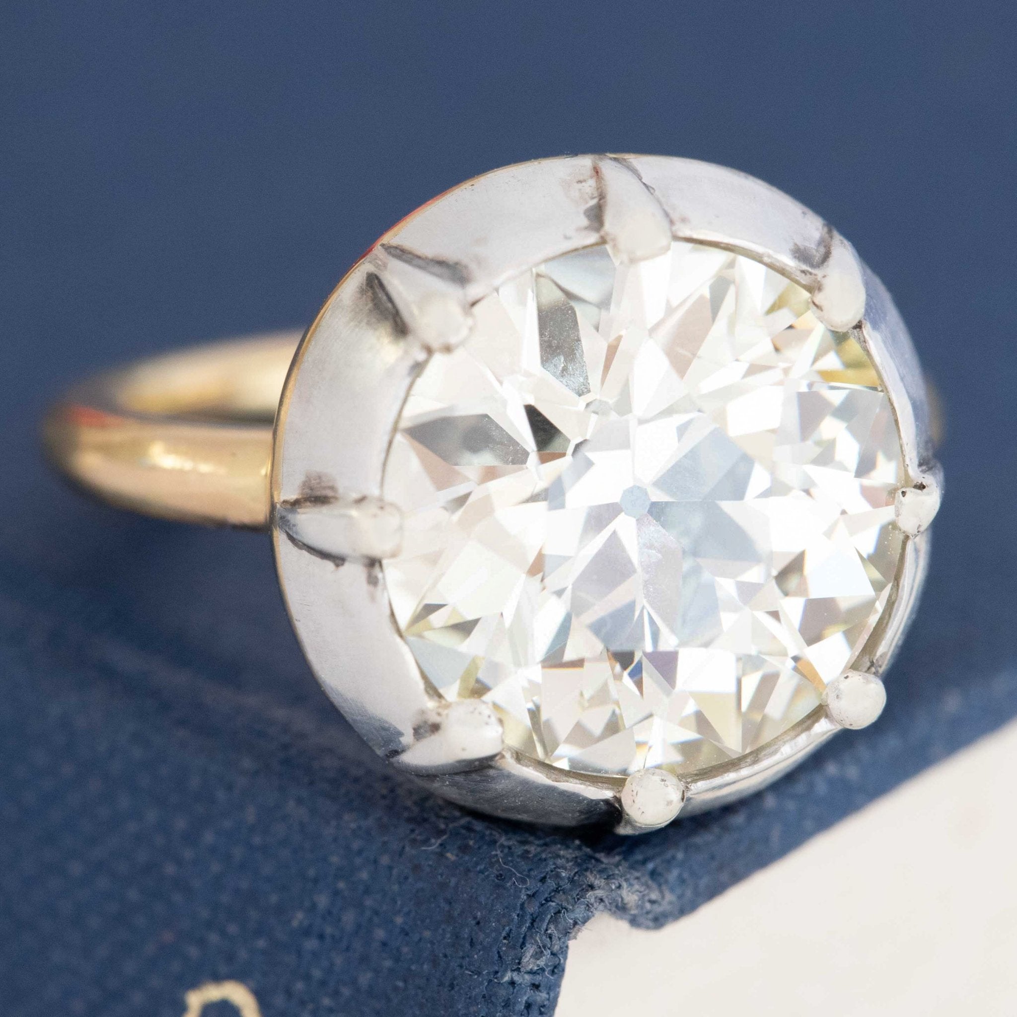 A 6.42ct old European cut diamond in a vintage inspired collet setting in silver and 18kt yellow gold. A beautiful vintage diamond and/or vintage engagement ring choice!