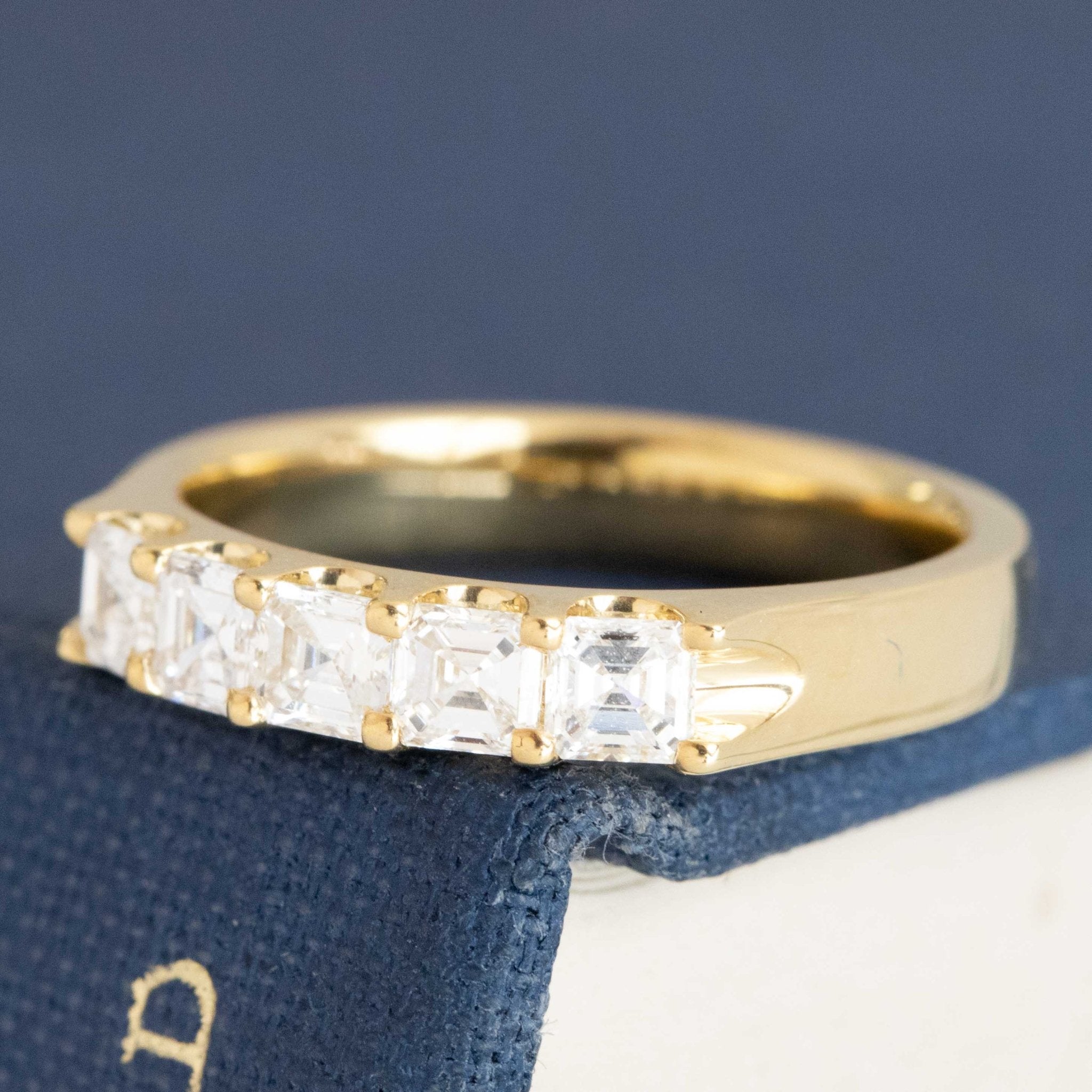 Close-up of .64ctw Asscher Cut Diamond 5-Stone Band, vintage-inspired band with Antique Diamonds, crafted in yellow gold