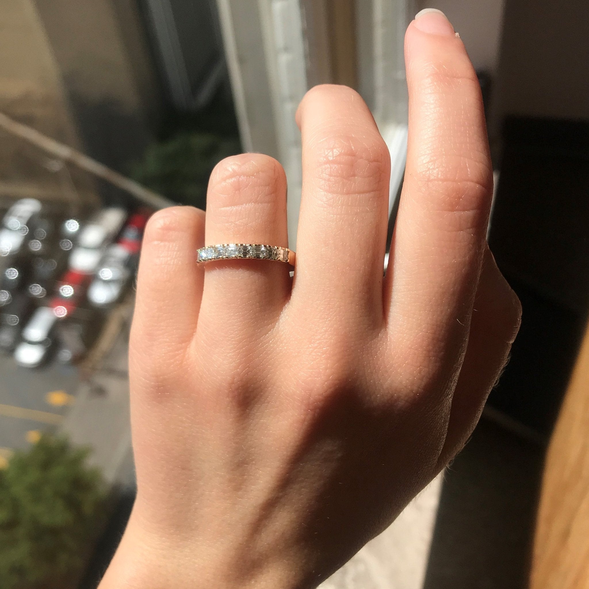 Elegant .64ctw Emerald Cut Diamond 8-Stone Band, romantic design with Antique Diamonds, Earth-mined diamonds in rose gold shown on ring finger