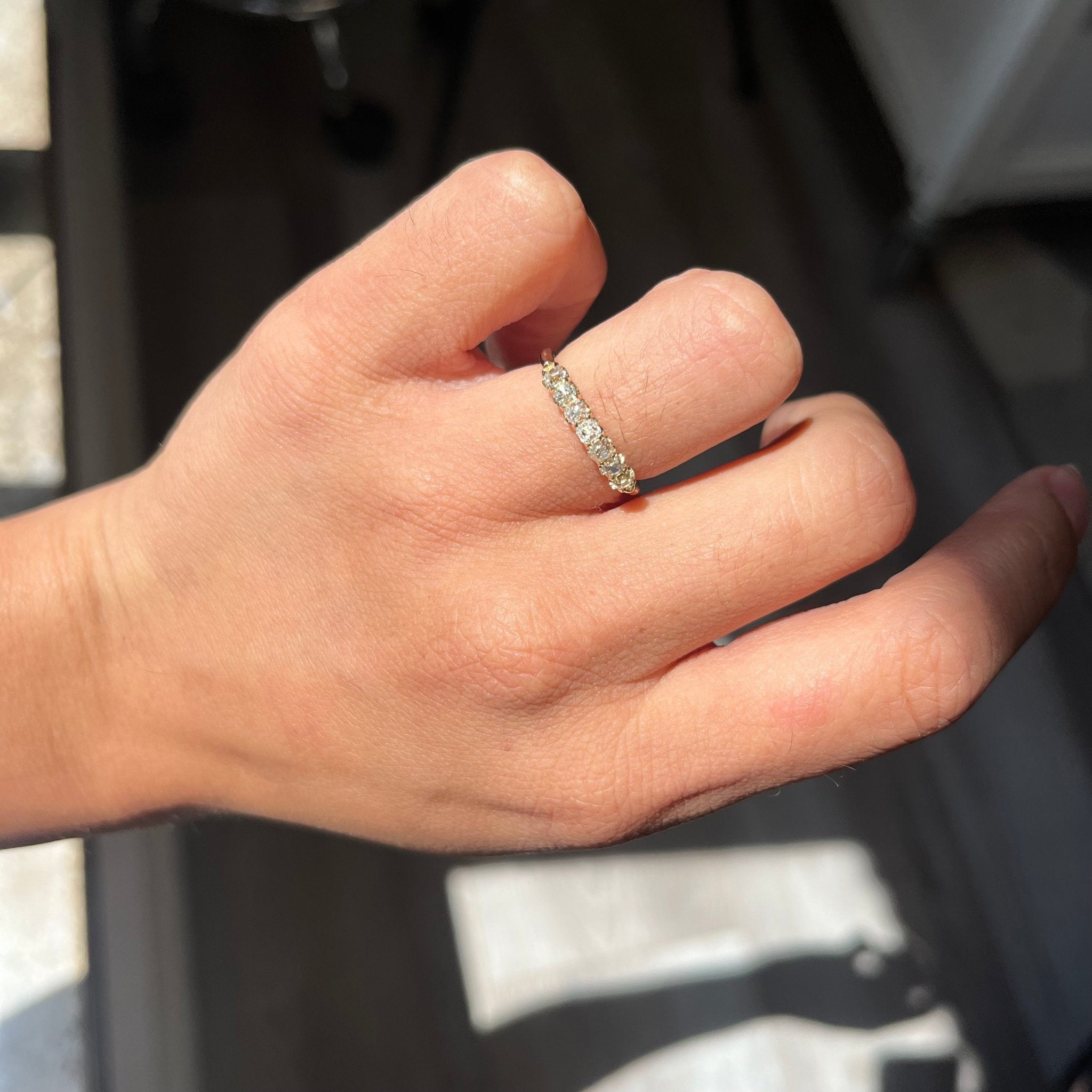 Elegant .64ctw Petite Old Mine Cut Diamond Half-Hoop Band, romantic design with Old Mine Cut Diamonds, Earth-mined diamonds in yellow gold shown on ring finger