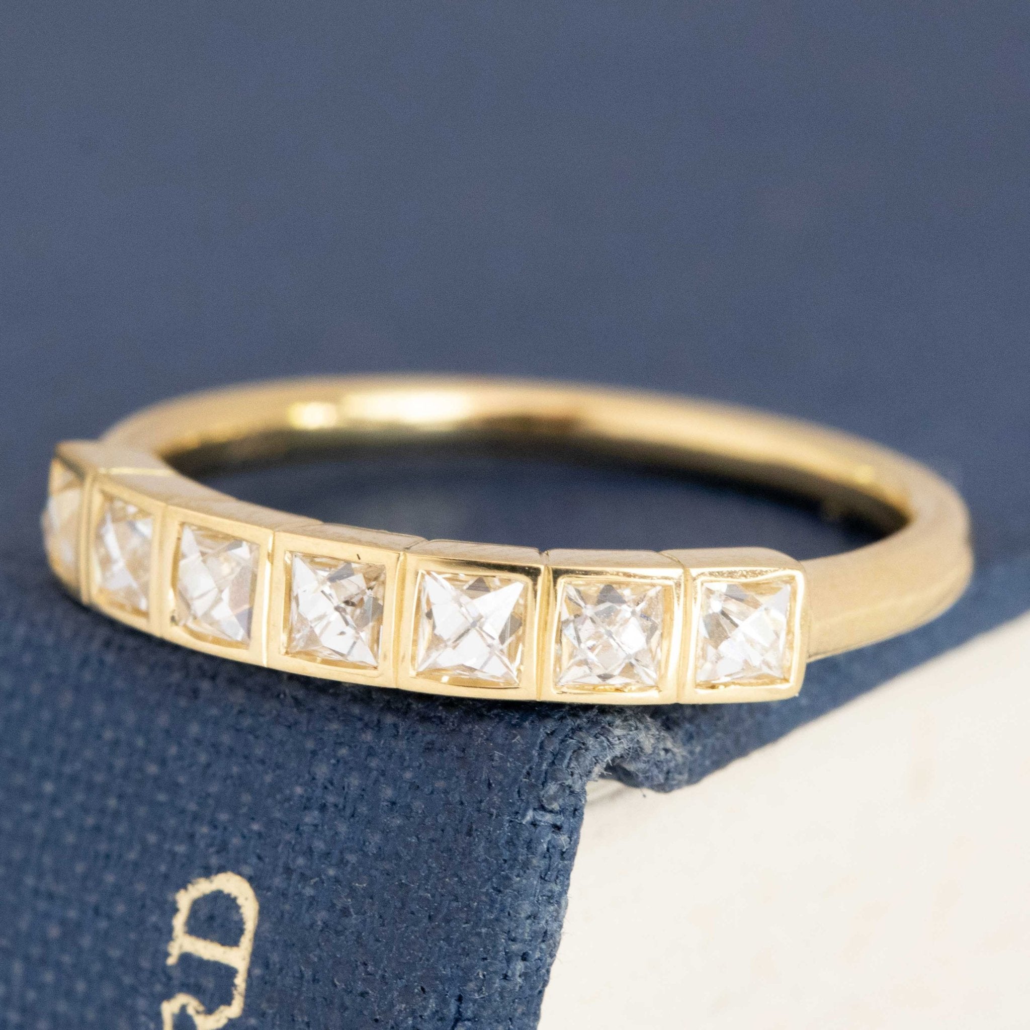 Antique lovers’ .65ctw French Cut Diamond Half-Hoop Bezel Band in yellow gold, featuring rare Earth-mined French Cut Diamonds