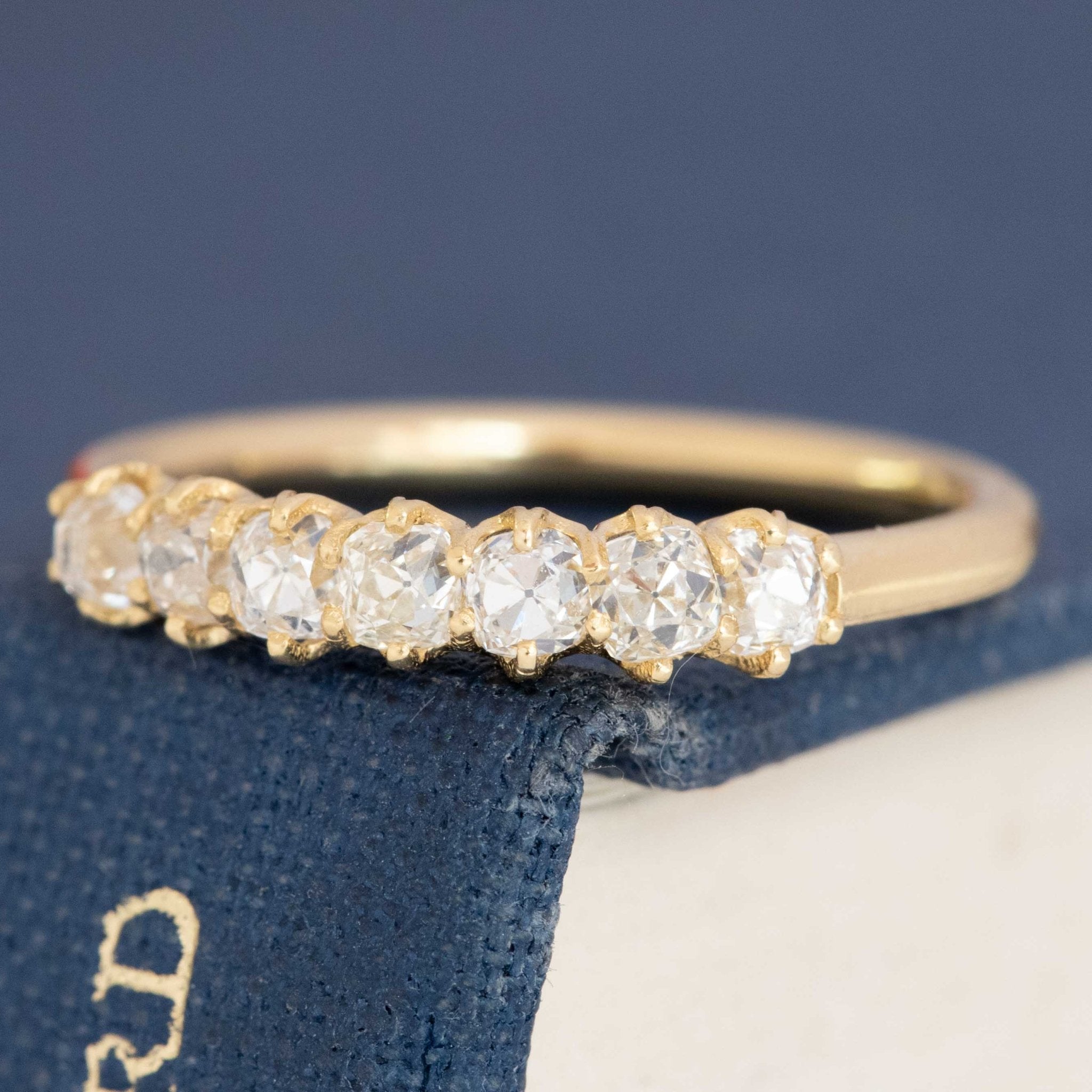 Delicate 7-stone diamond band, antique Old Mine cut, subtle glow