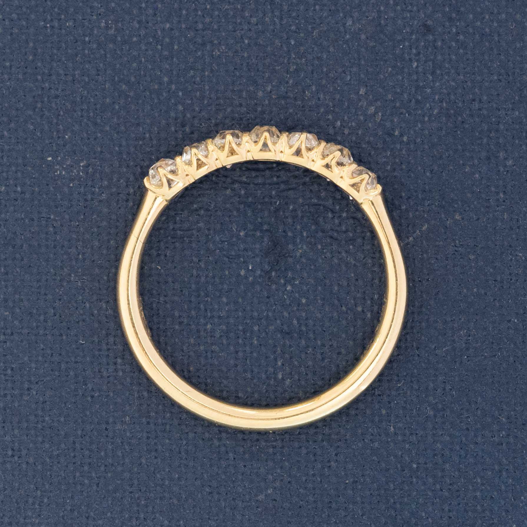 Profile of delicate 7-stone Old Mine band diamond ring”