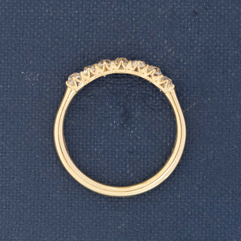 Profile of delicate 7-stone Old Mine band diamond ring”