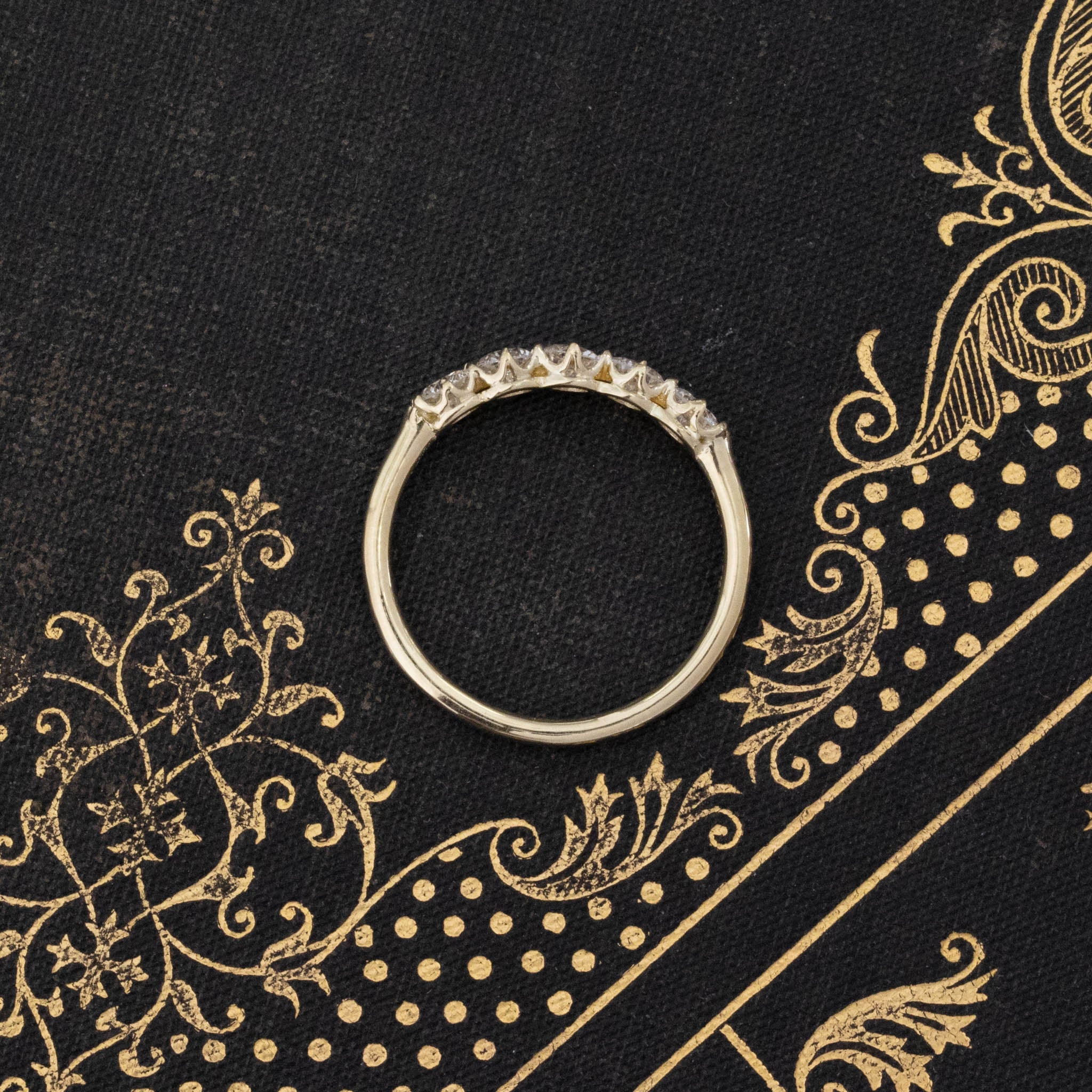 Side view of .69ctw Round Brilliant Cut Diamond 5-Stone Band, vintage-inspired band with Antique Diamonds, crafted in yellow gold