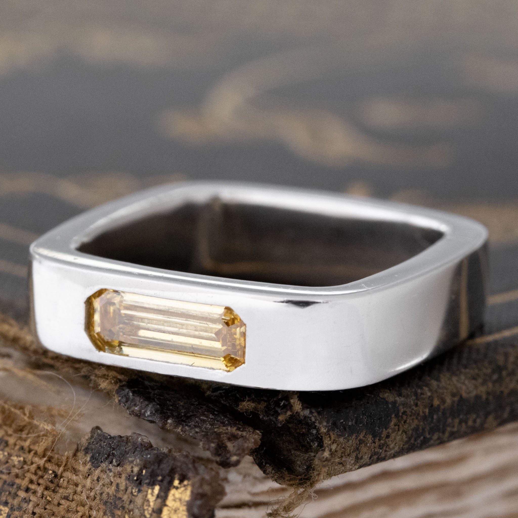 Close-up of .70ct Emerald Cut Diamond Square Shank Band, GIA, vintage-inspired band with Baguette Cut Diamonds, crafted in platinum