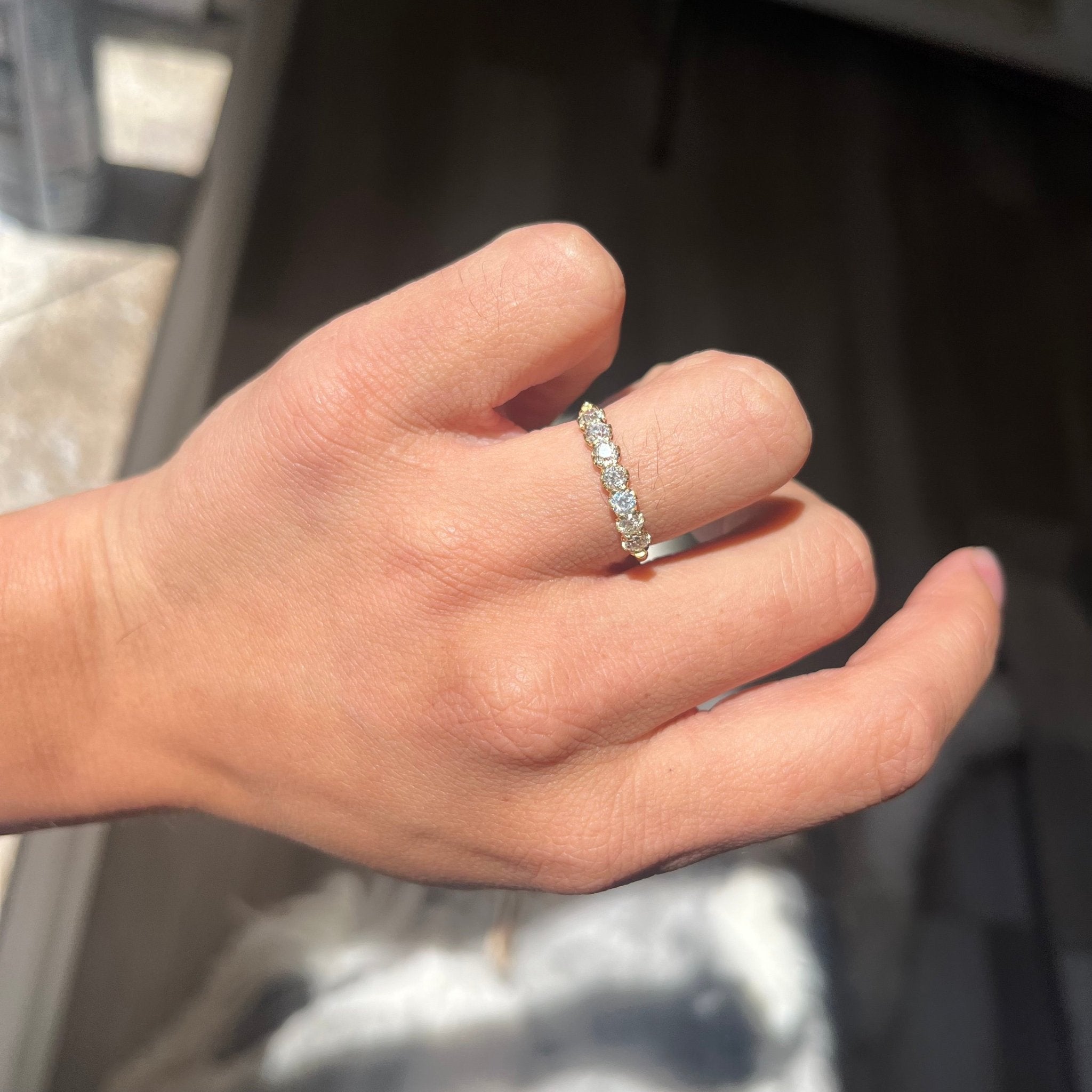 Elegant .70ctw Old European Cut Diamond Half-Hoop Band, romantic design with Old European Cut Diamonds, Earth-mined diamonds in yellow gold shown on ring finger