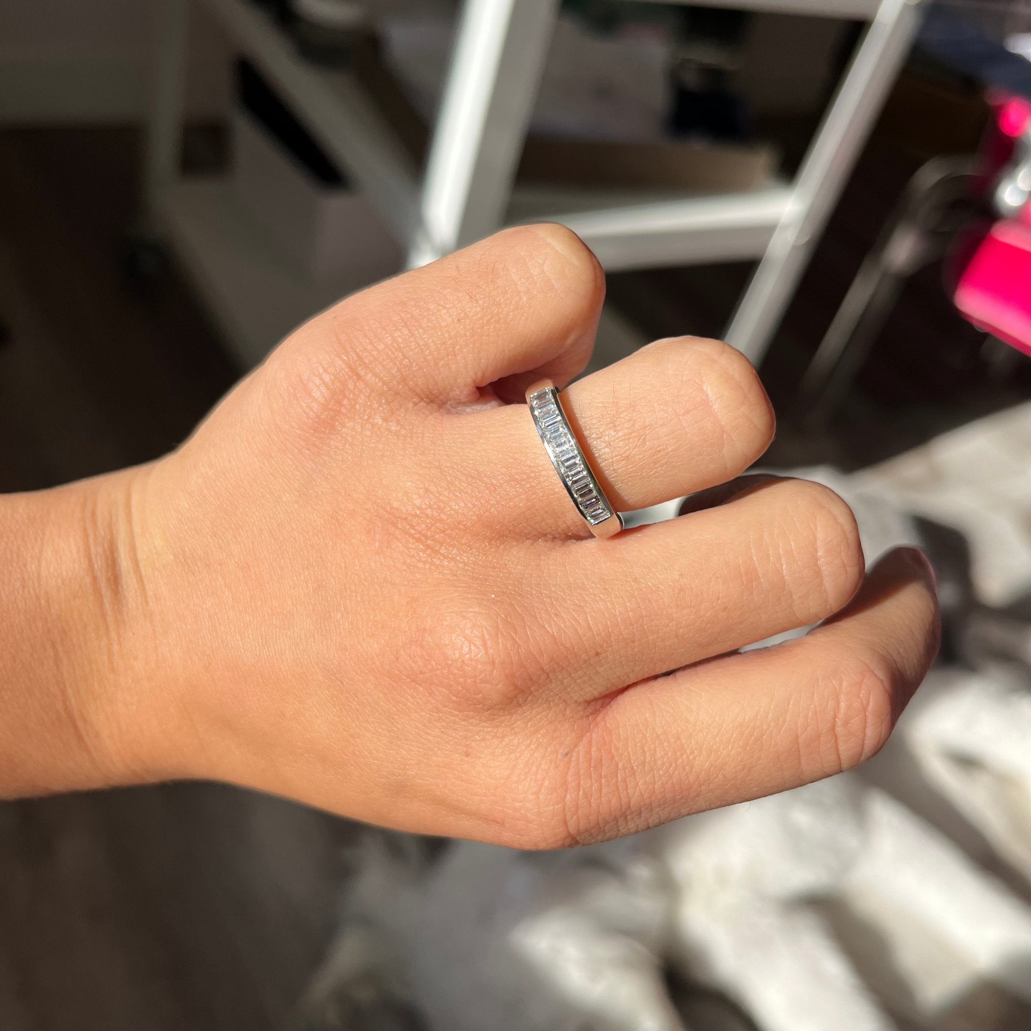 Elegant .71ctw Baguette Cut Diamond Channel Set Band, romantic design with Baguette Cut Diamonds, Earth-mined diamonds in platinum shown on ring finger