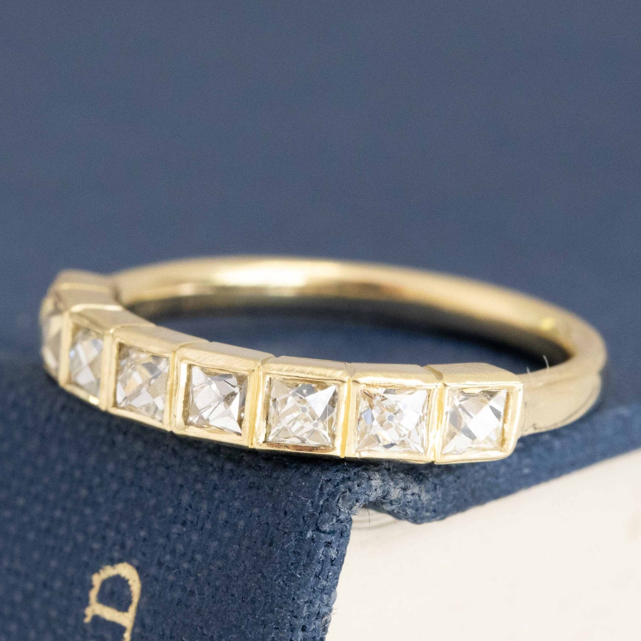 Close-up of .71ctw French Cut Diamond Bezel Band, vintage-inspired band with French Cut Diamonds, crafted in yellow gold