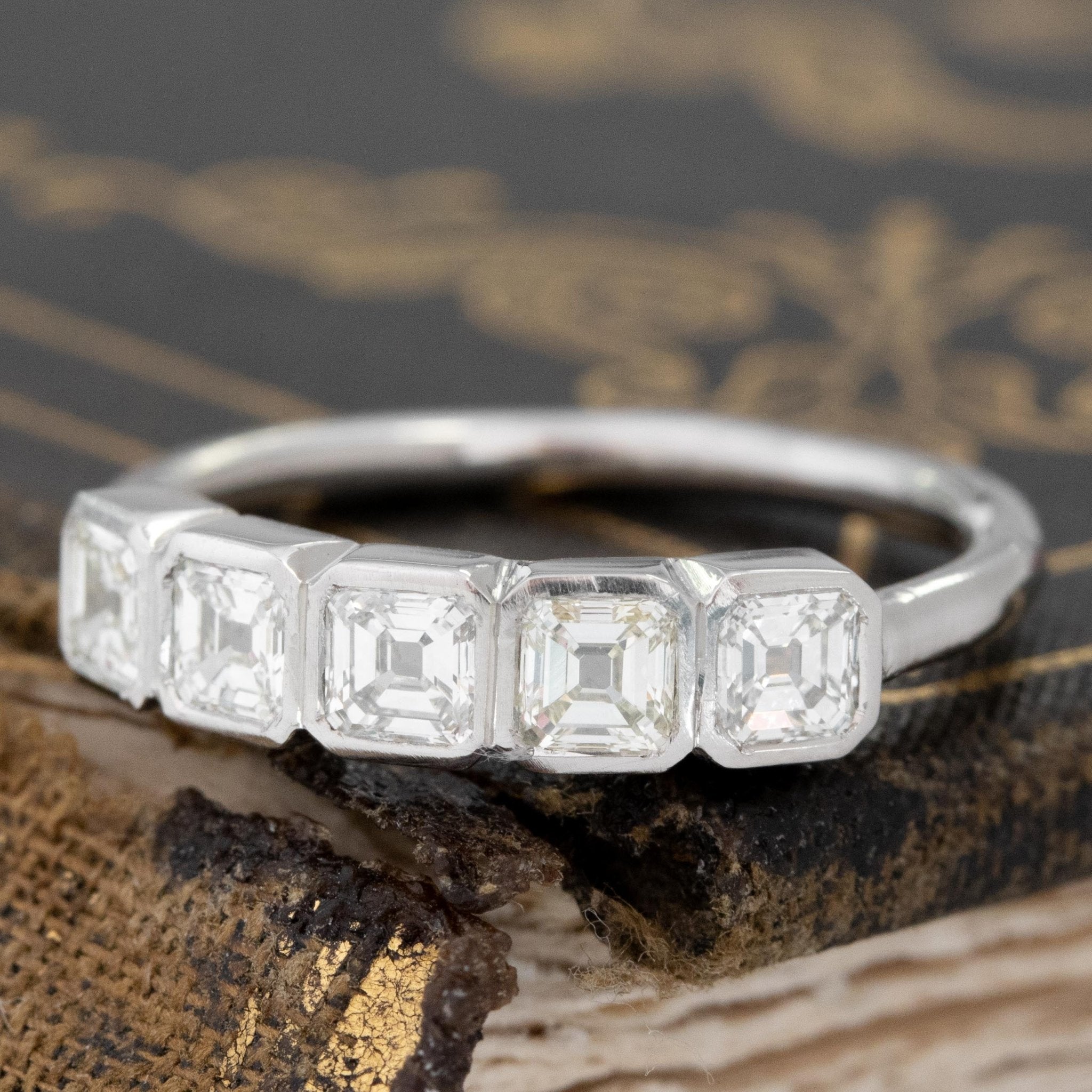 Antique lovers’ .73ctw Asscher Cut Diamond Bezel 5-Stone Band in platinum, featuring rare Earth-mined Antique Diamonds