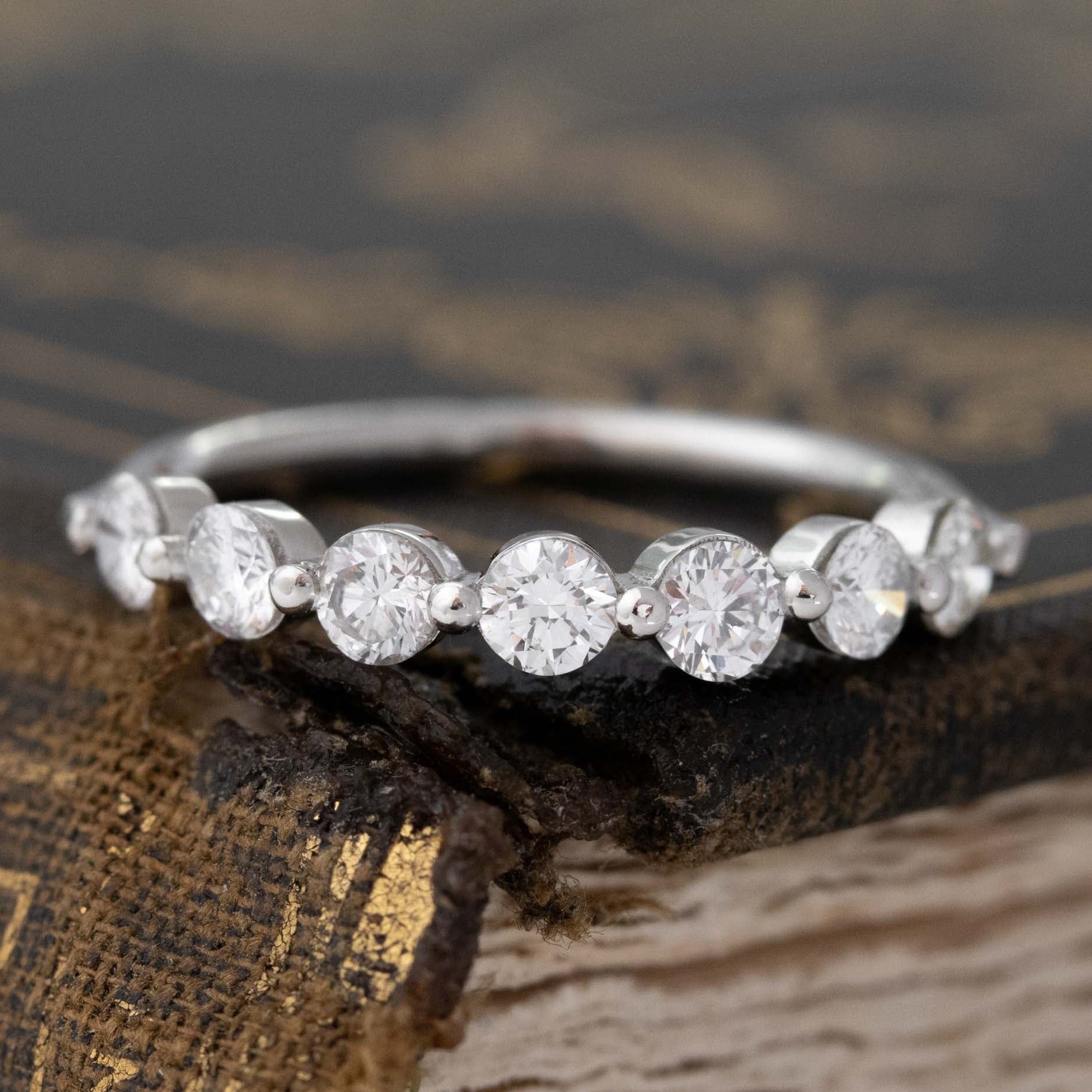 .74ctw Round Brilliant Cut Diamond Shared-Prong Band with Antique Diamonds in platinum, antique-inspired one-of-a-kind wedding band