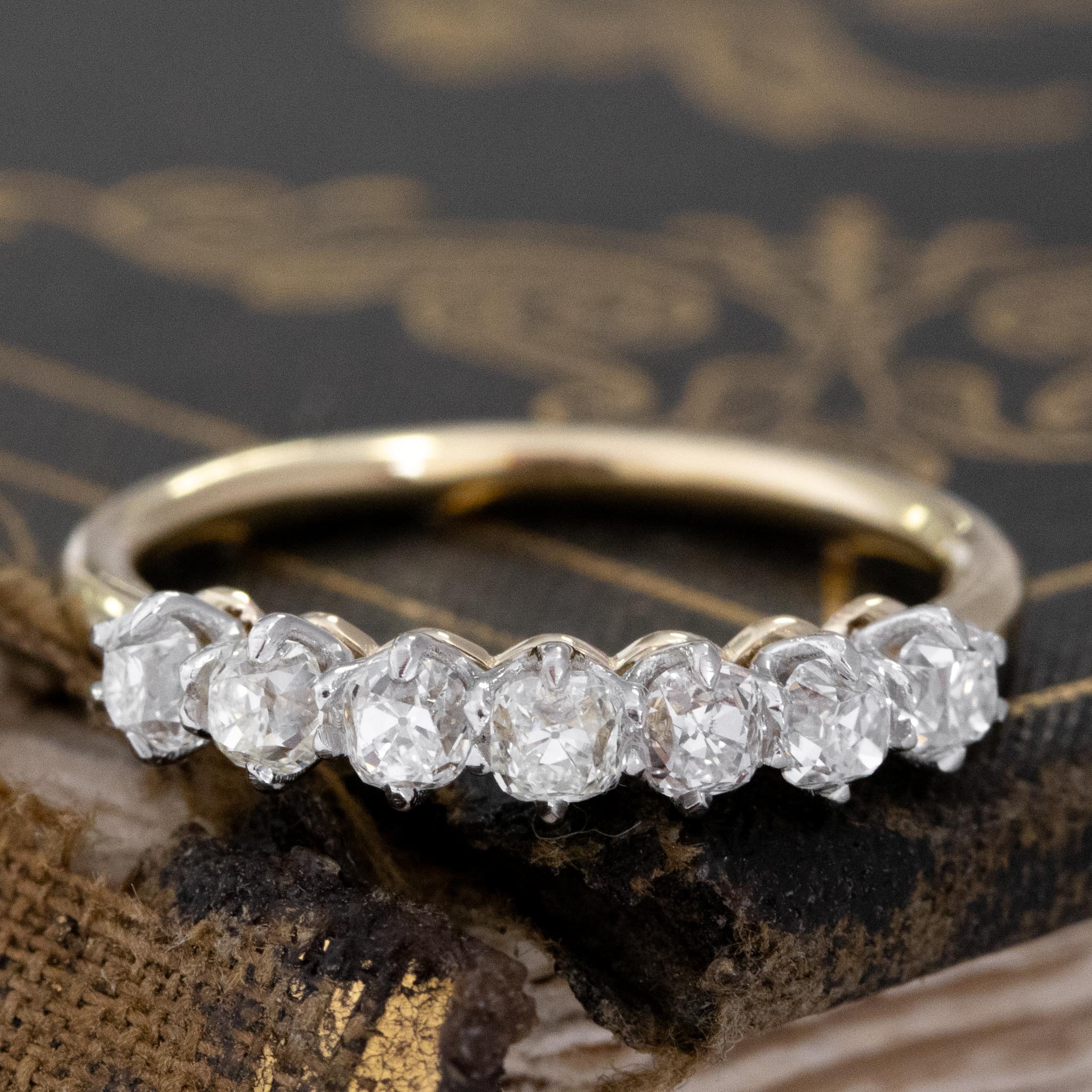 .75ctw Old Mine Cut Diamond 7-Stone Half-Hoop Band with Old Mine Cut Diamonds with a platinum gallery and yellow gold shank, antique-inspired one-of-a-kind wedding band