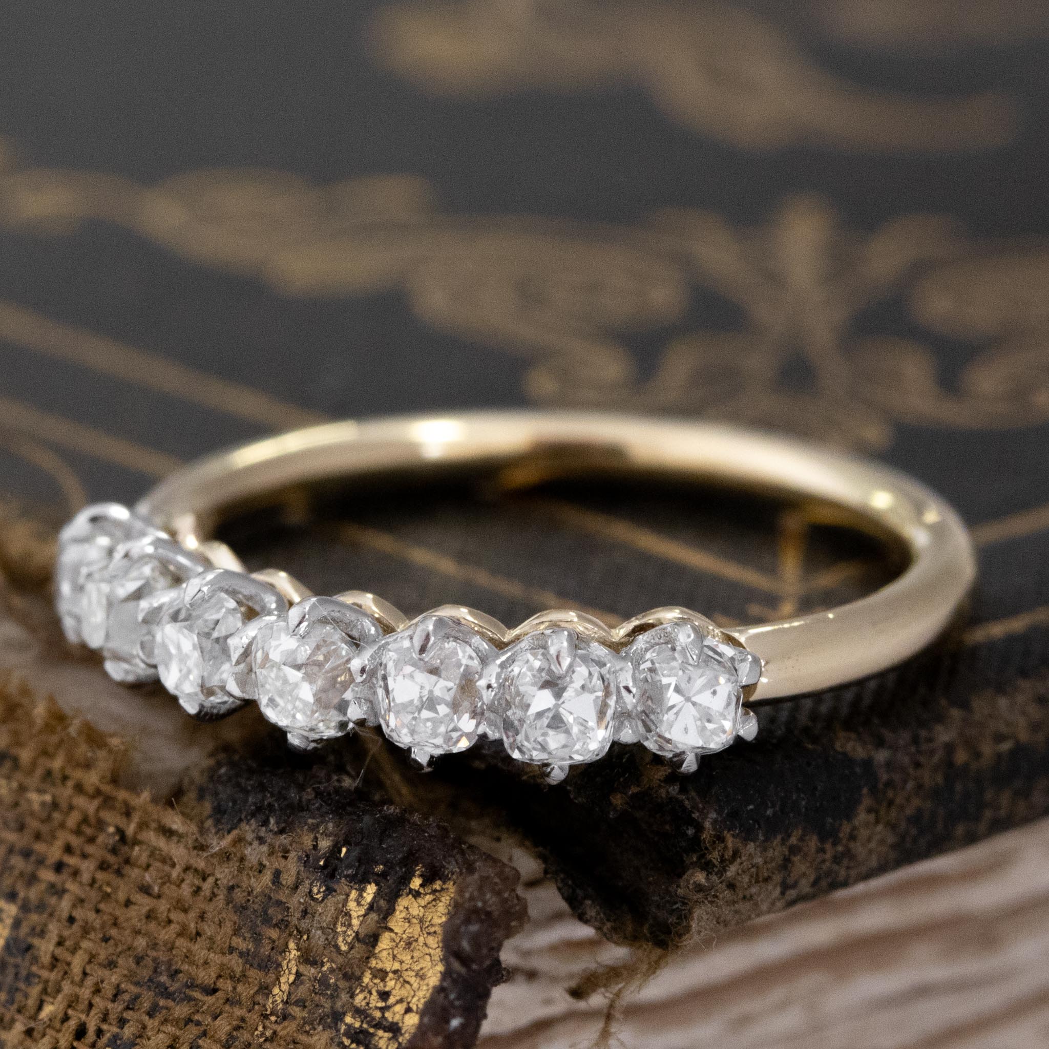 Antique lovers’ .75ctw Old Mine Cut Diamond 7-Stone Half-Hoop Band with a platinum gallery and yellow gold shank, featuring rare Earth-mined Old Mine Cut Diamonds
