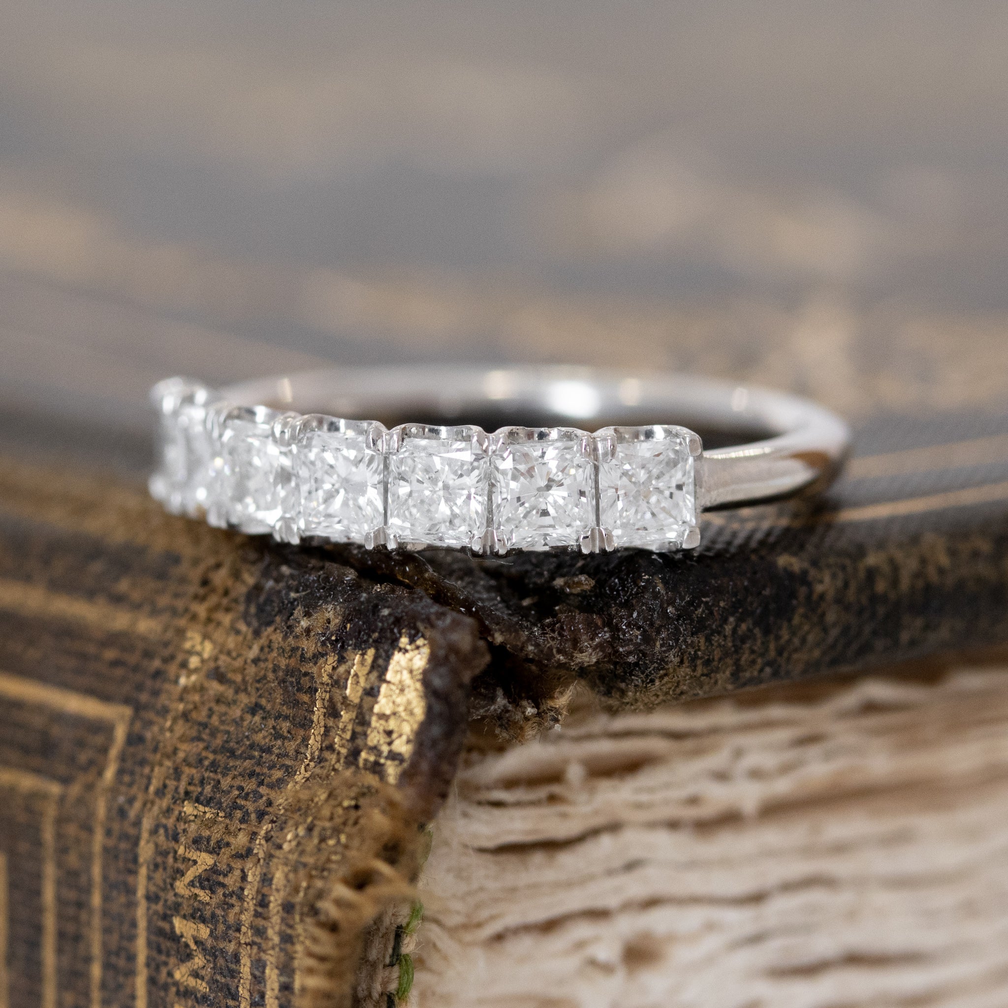 Close-up of .78ctw Radiant Cut Diamond 7-Stone Band, vintage-inspired band with Antique Diamonds, crafted in platinum