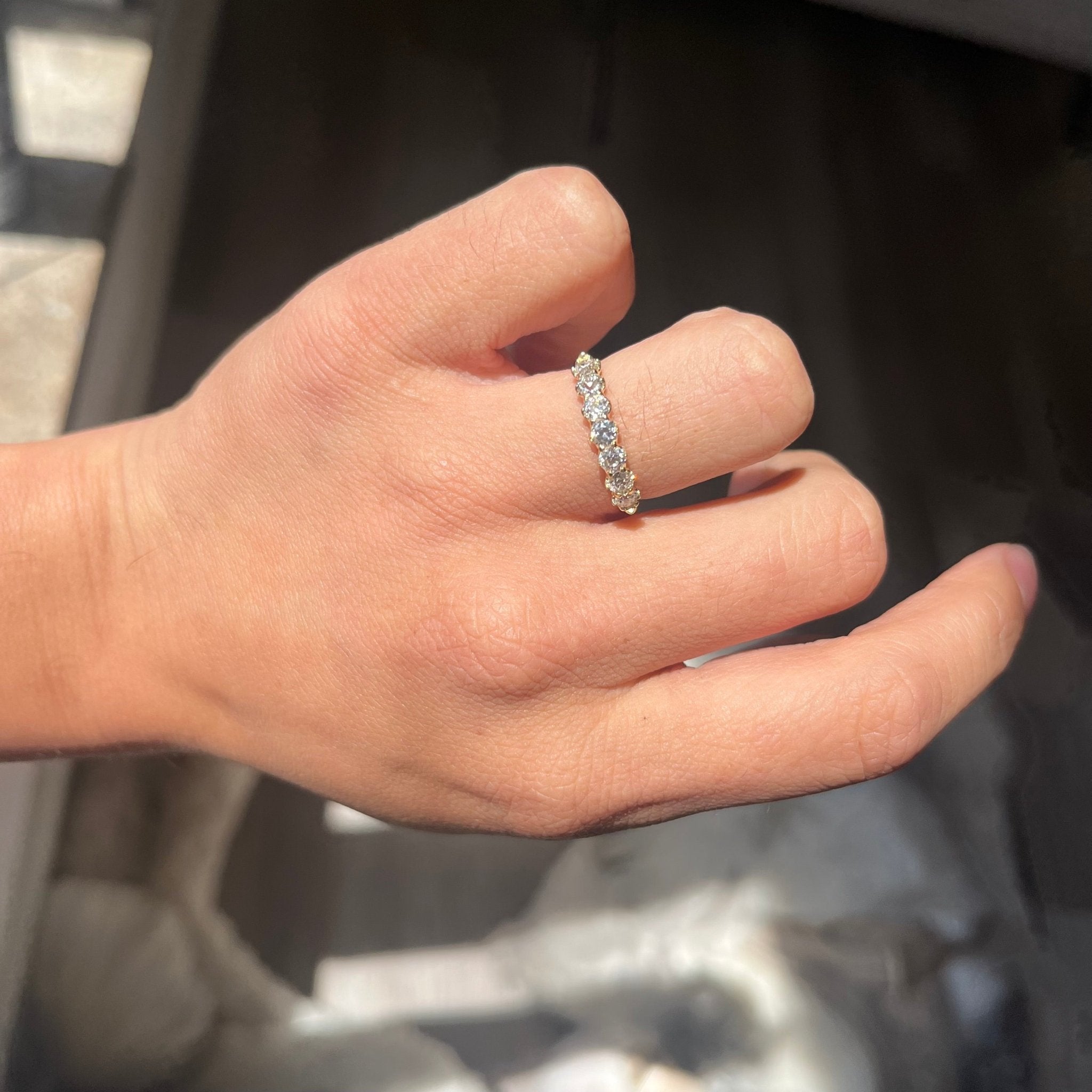 Elegant .81ctw Old European Cut Diamond Half-Hoop Band, romantic design with Old European Cut Diamonds, Earth-mined diamonds in yellow gold shown on ring finger