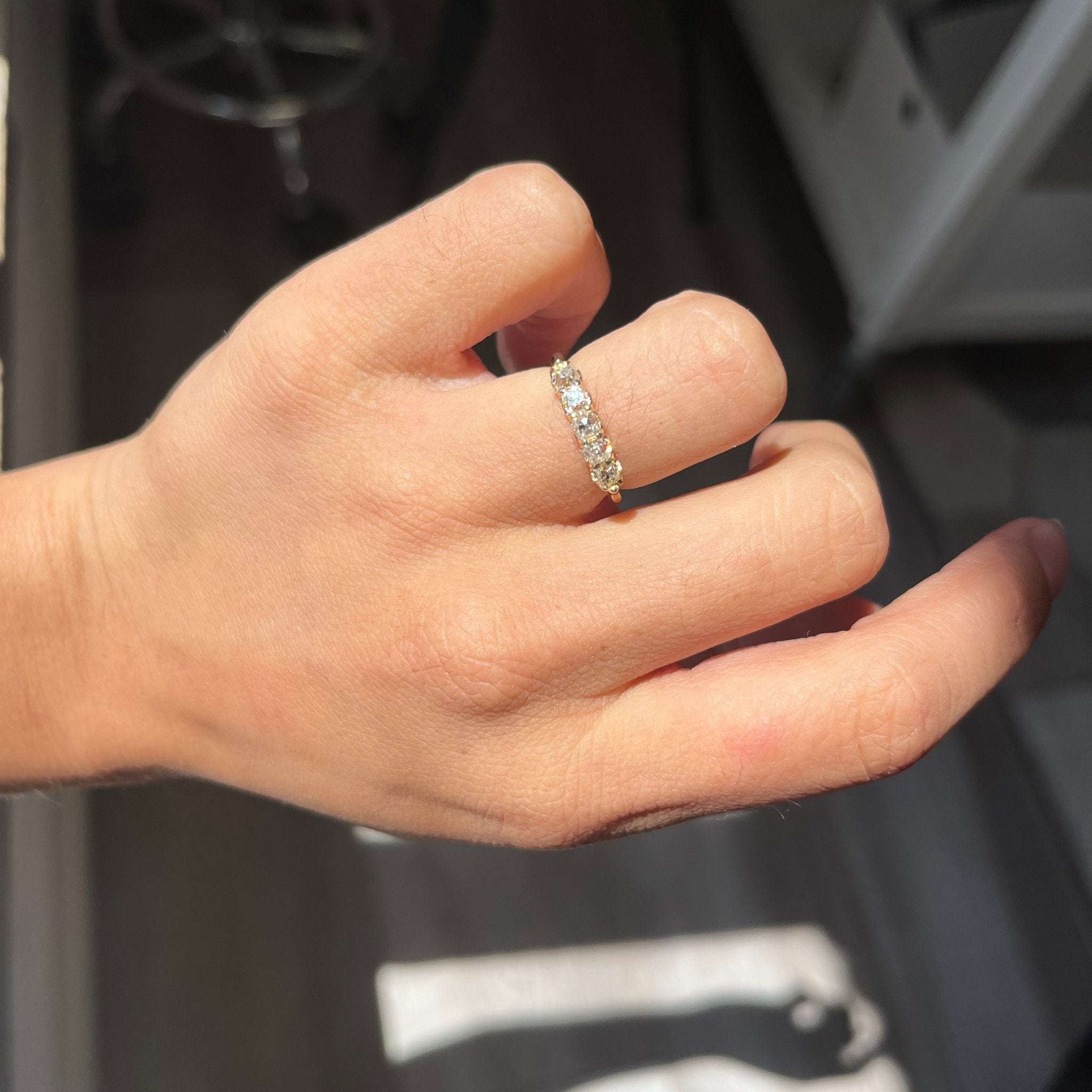 Elegant .82ctw Petite Old Mine Cut Diamond 5-Stone Band, romantic design with Old Mine Cut Diamonds, Earth-mined diamonds in yellow gold shown on ring finger