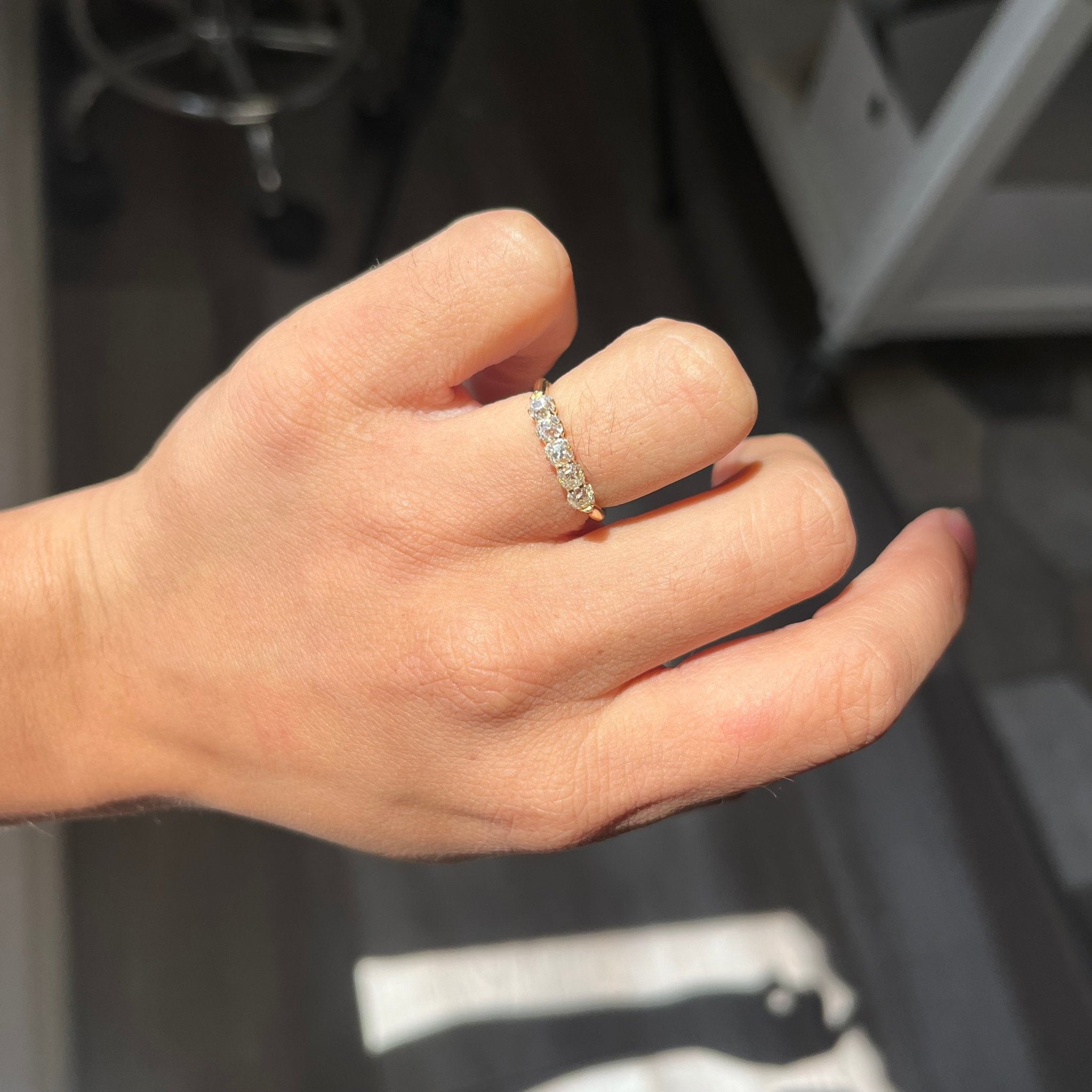 Elegant .83ctw Petite Old Mine Cut Diamond 5-Stone Band, romantic design with Old Mine Cut Diamonds, Earth-mined diamonds in yellow gold shown on ring finger