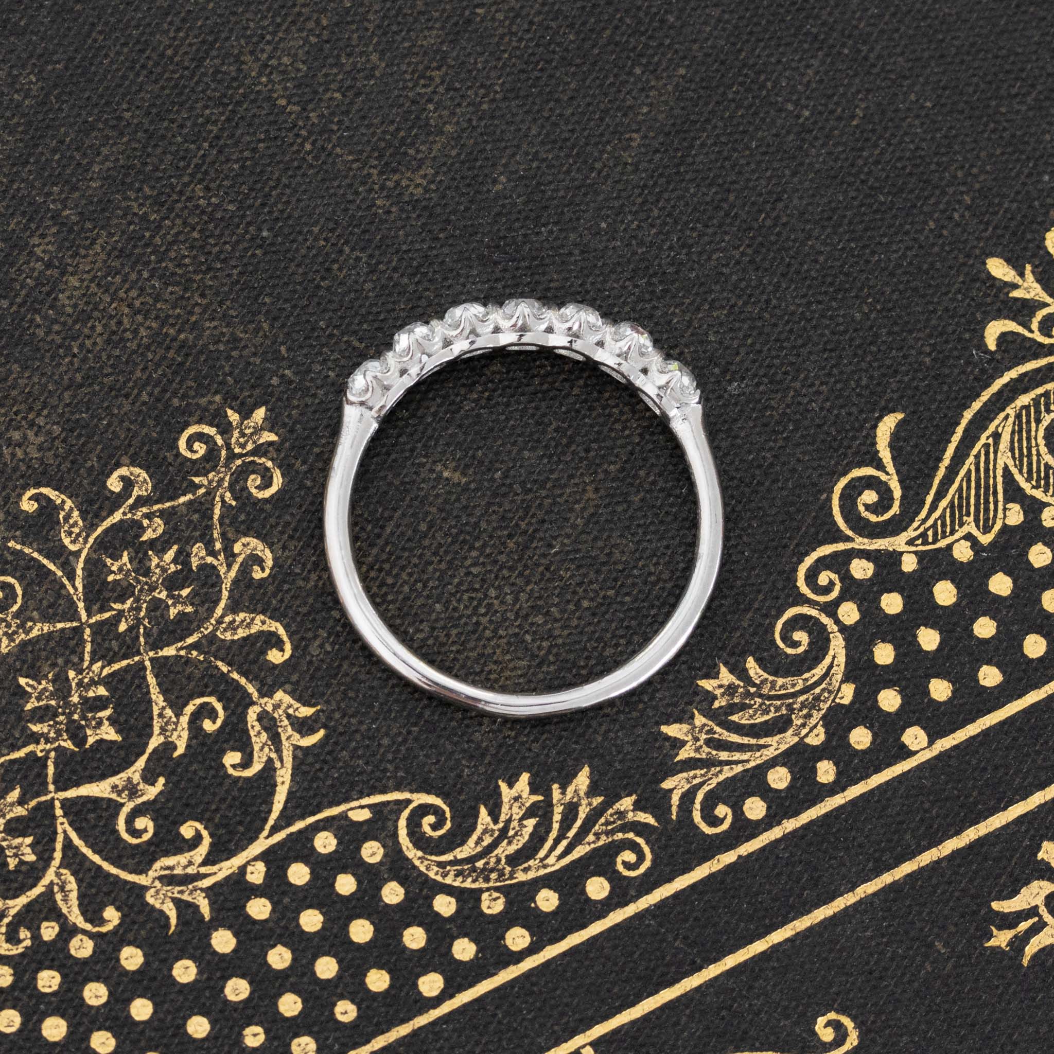 Side view of .83ctw Petite Old Mine Cut Diamond 7-Stone Band, vintage-inspired band with Old Mine Cut Diamonds, crafted in platinum