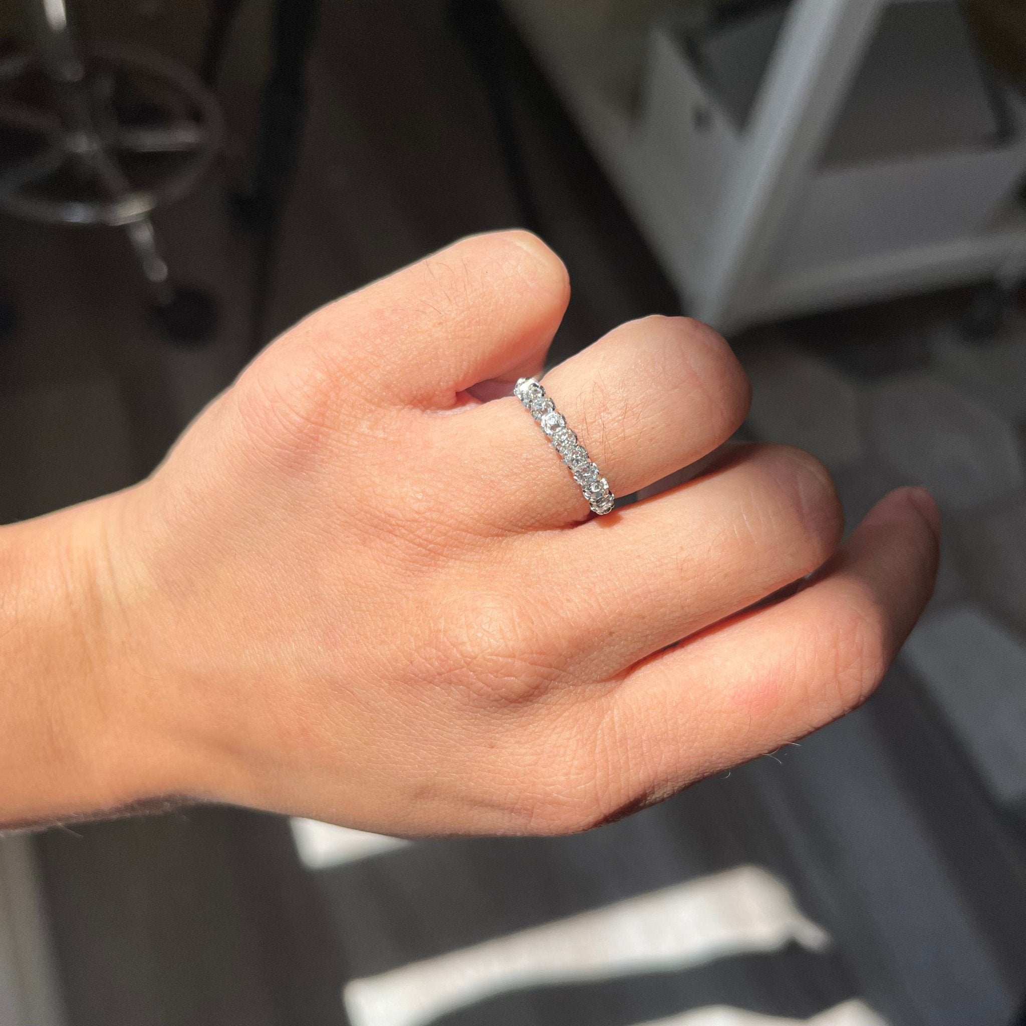 Elegant .83ctw Petite Old Mine Cut Diamond Half-Hoop Band, romantic design with Old Mine Cut Diamonds, Earth-mined diamonds in platinum shown on ring finger