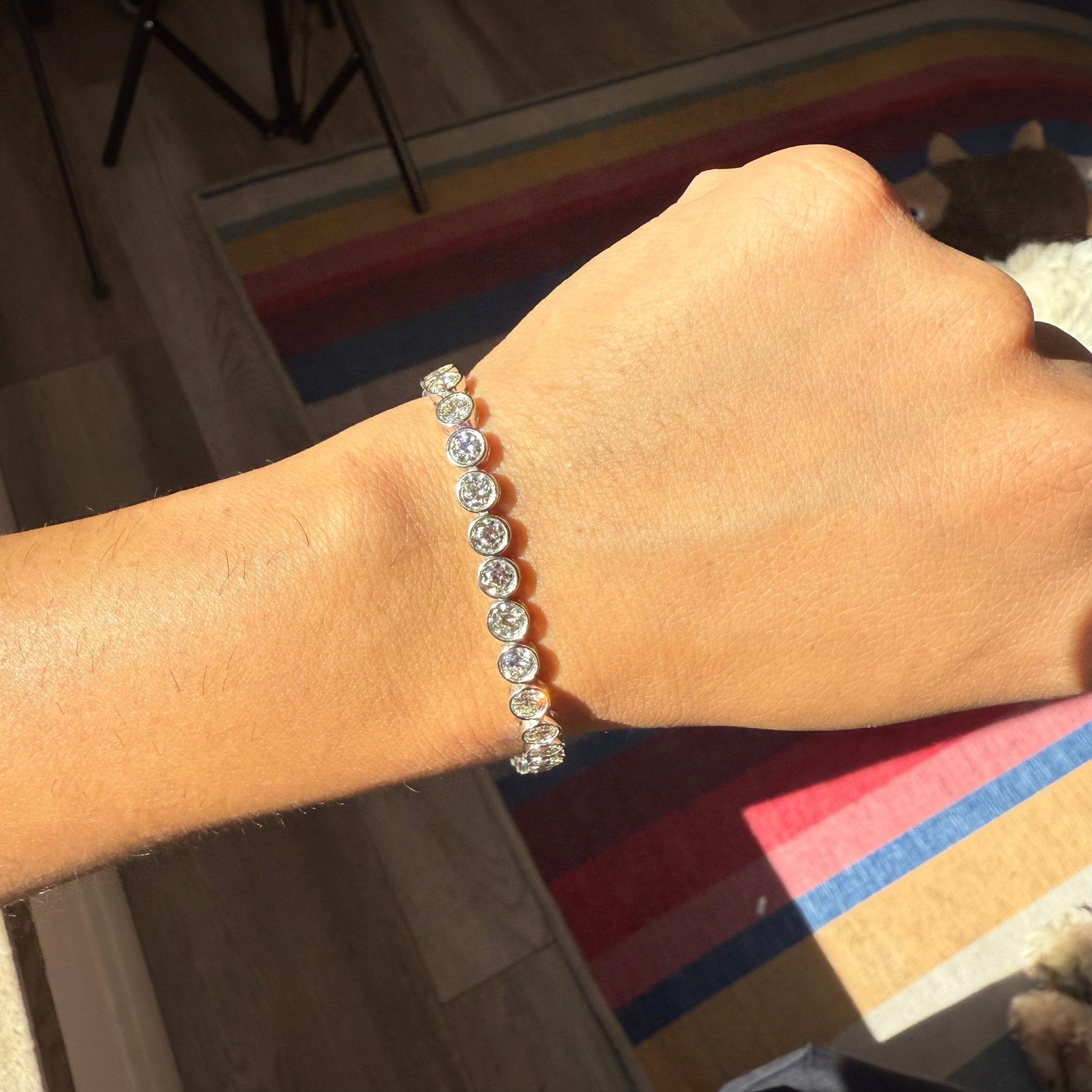 Elegant old European diamond bezel tennis bracelet on wrist