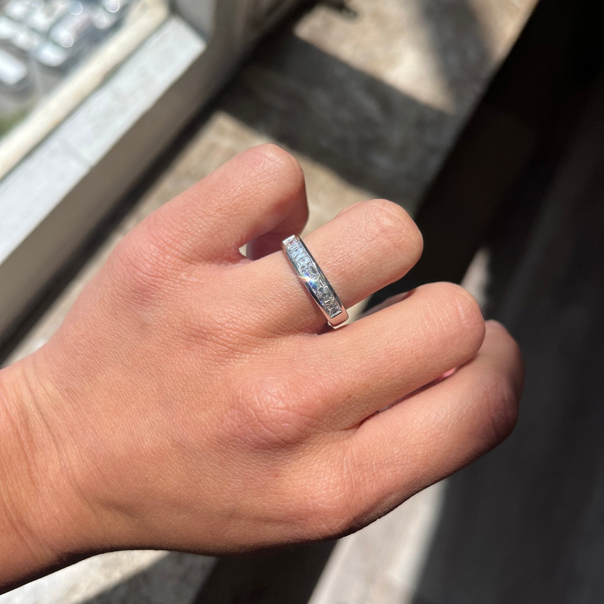 Elegant .85ctw Asscher Cut Diamond Channel Set Band, romantic design with Antique Diamonds, Earth-mined diamonds in platinum shown on ring finger