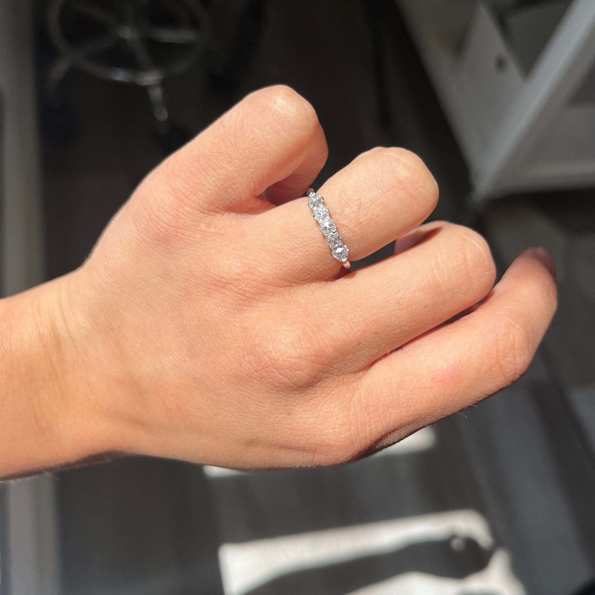 Elegant .85ctw Petite Old Mine Cut Diamond 5-Stone Band, romantic design with Old Mine Cut Diamonds, Earth-mined diamonds in platinum shown on ring finger