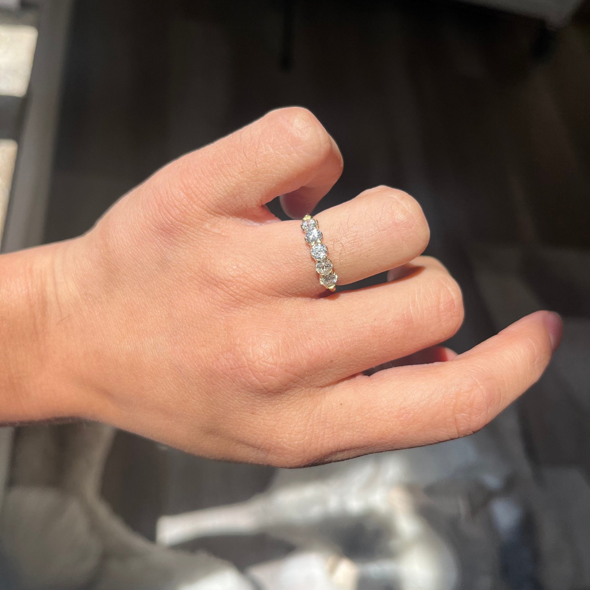 Elegant .86ctw Old European Cut Diamond 5-Stone Band, romantic design with Old European Cut Diamonds, Earth-mined diamonds in yellow gold shown on ring finger