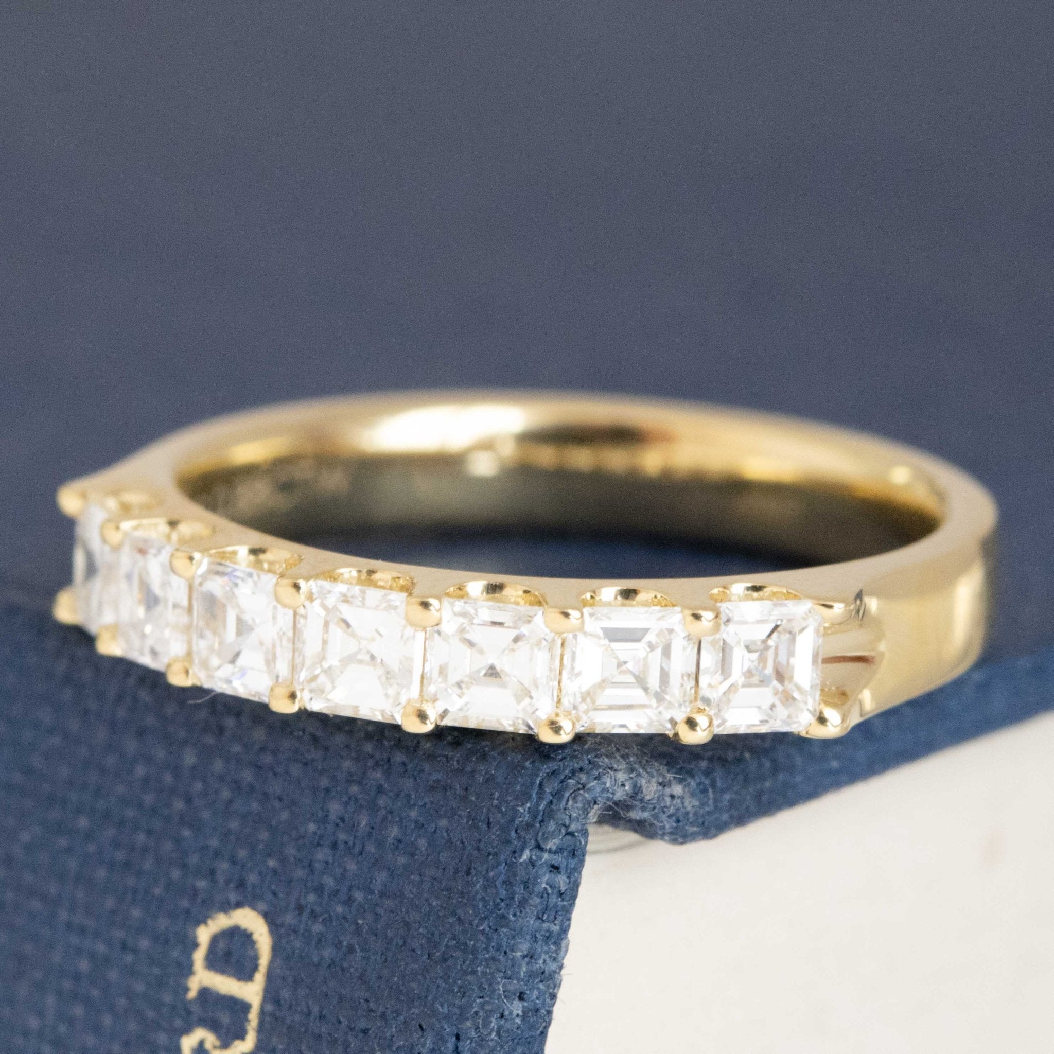 Antique lovers’ .88ctw Asscher Cut Diamond 7-Stone Band in yellow gold, featuring rare Earth-mined Antique Diamonds