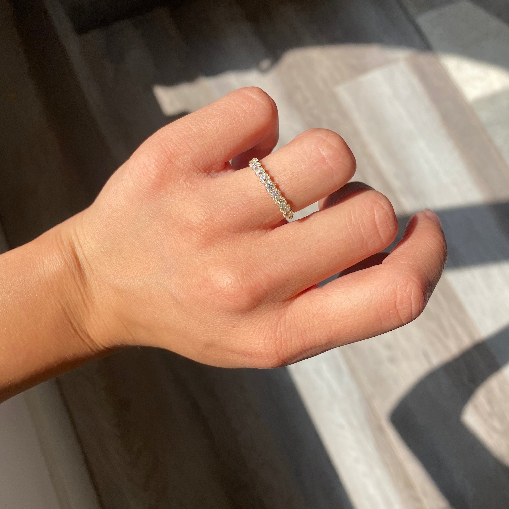 Elegant .89ctw Petite Old Mine Cut Diamond Half-Hoop Band, romantic design with Old Mine Cut Diamonds, Earth-mined diamonds in yellow gold shown on ring finger