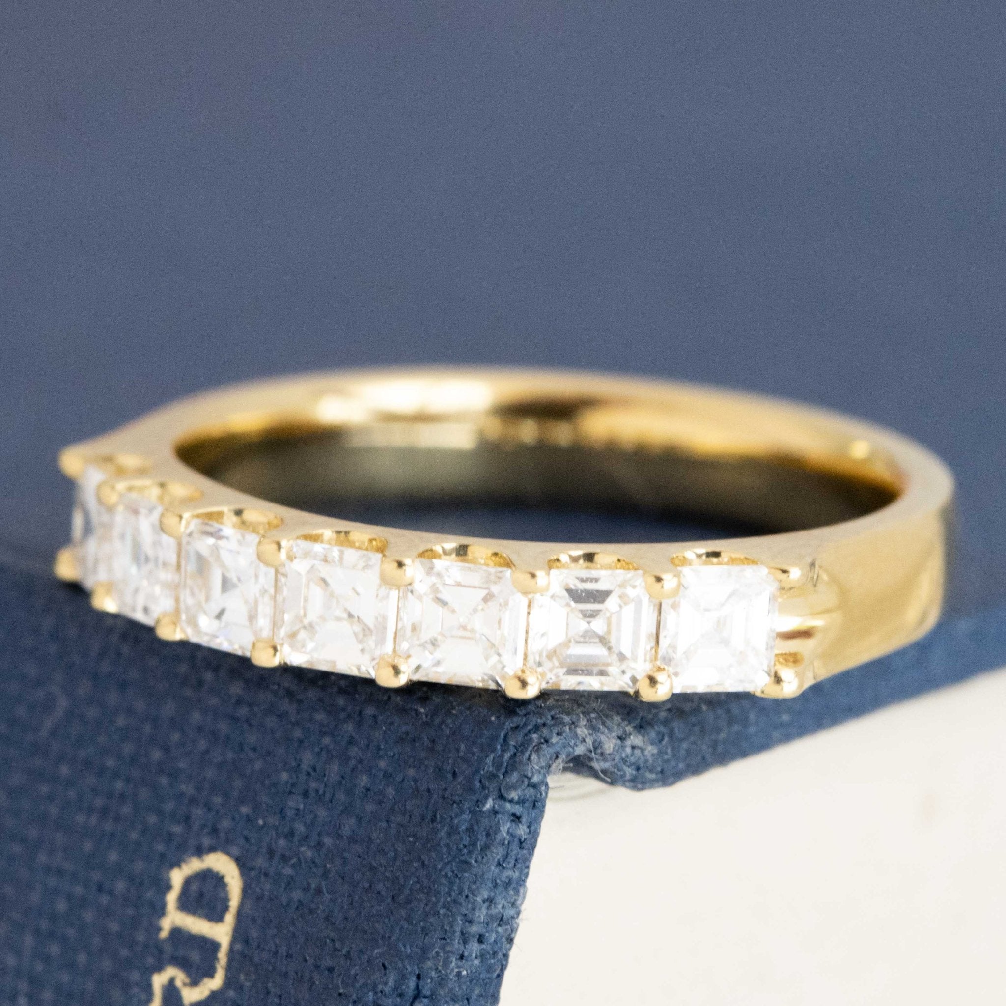 Antique lovers’ .90ctw Asscher Cut Diamond 7-Stone Band in yellow gold, featuring rare Earth-mined Antique Diamonds