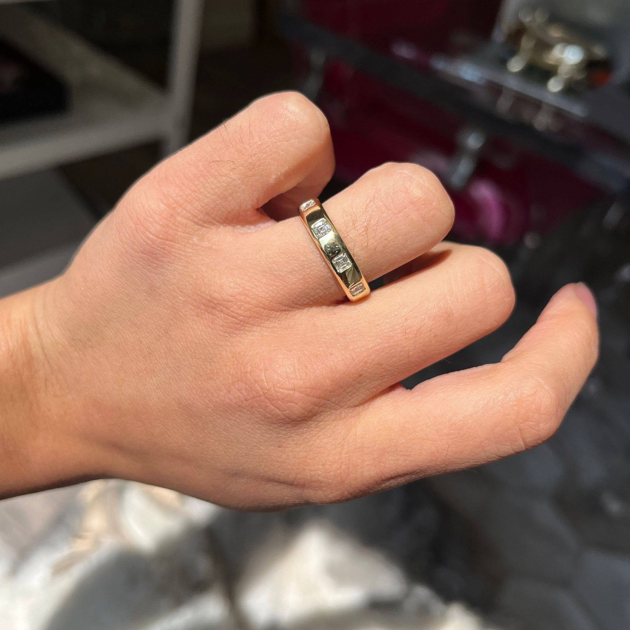 Elegant .90ctw Asscher Cut Diamond Scatter Eternity Band, romantic design with Antique Diamonds, Earth-mined diamonds in yellow gold shown on ring finger