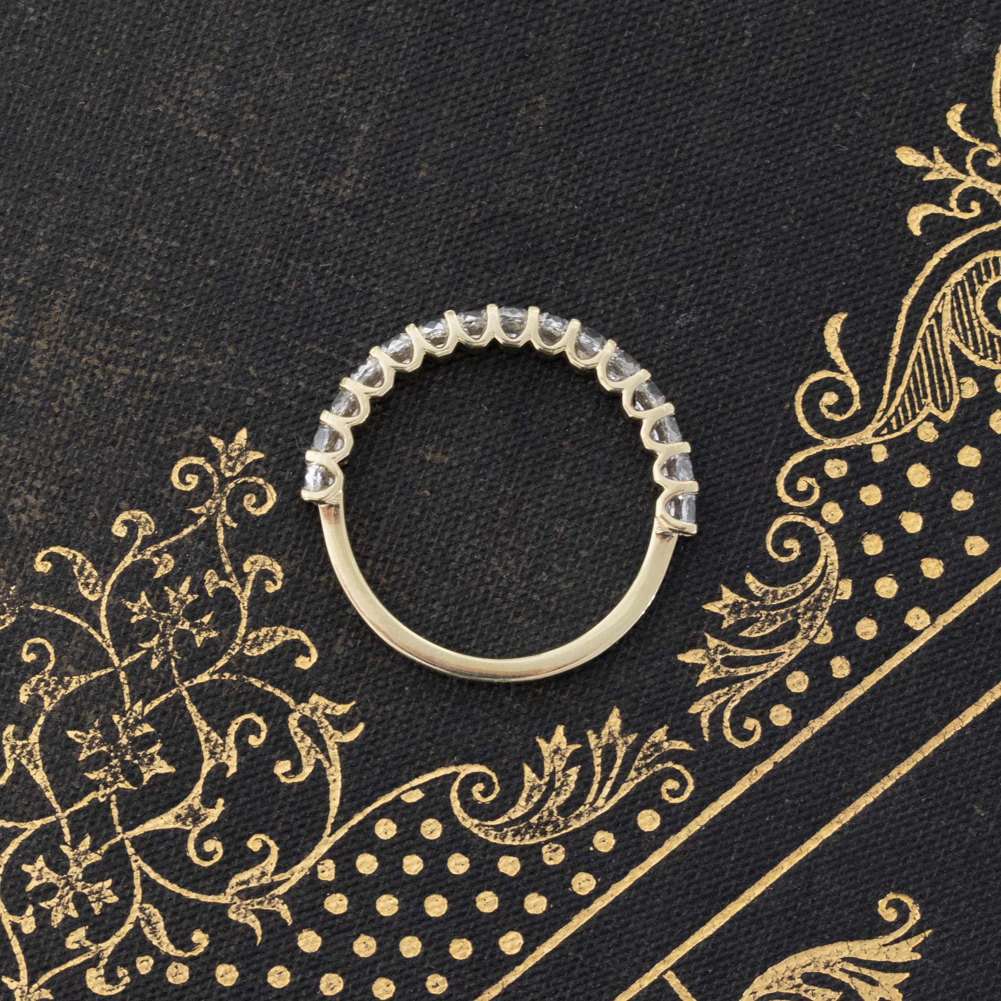 Side view of .90ctw Petite Old Mine Cut Diamond Half-Eternity Band, vintage-inspired band with Old Mine Cut Diamonds, crafted in yellow gold